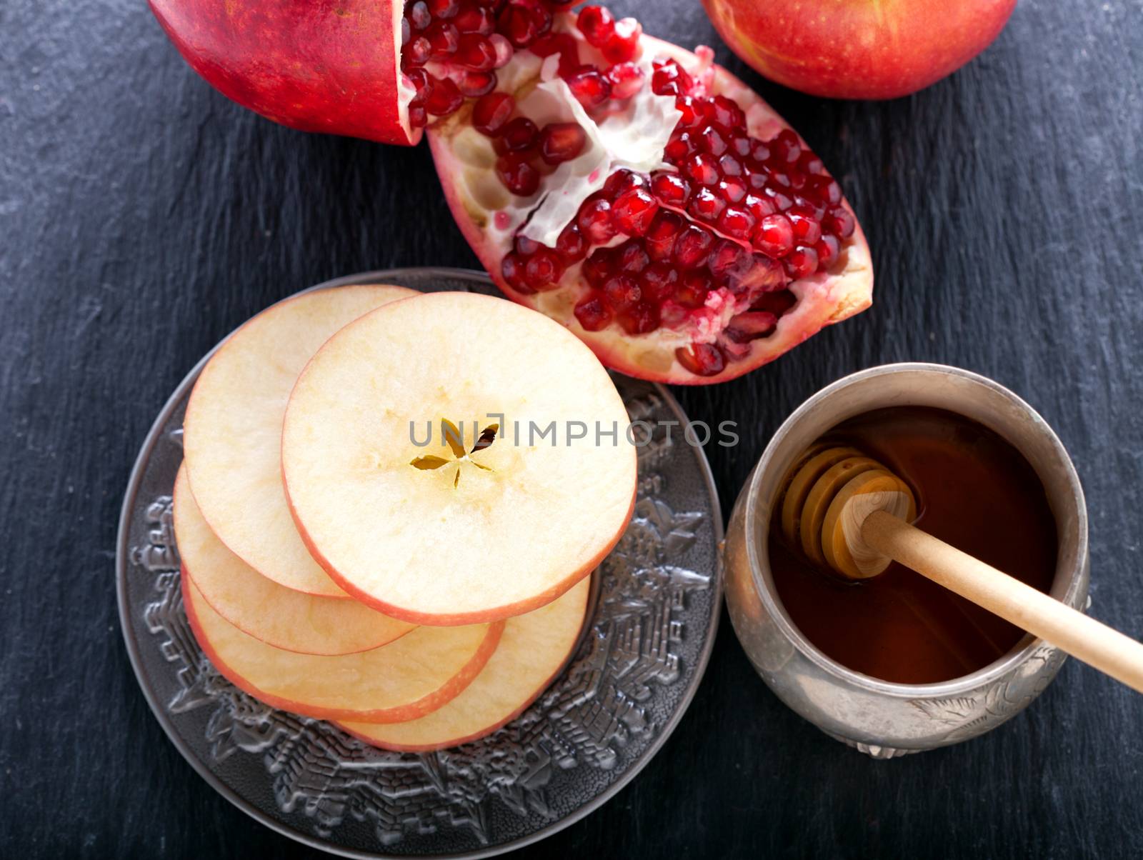 Apples, pomegranate and honey for Rosh Hashanah  by supercat67