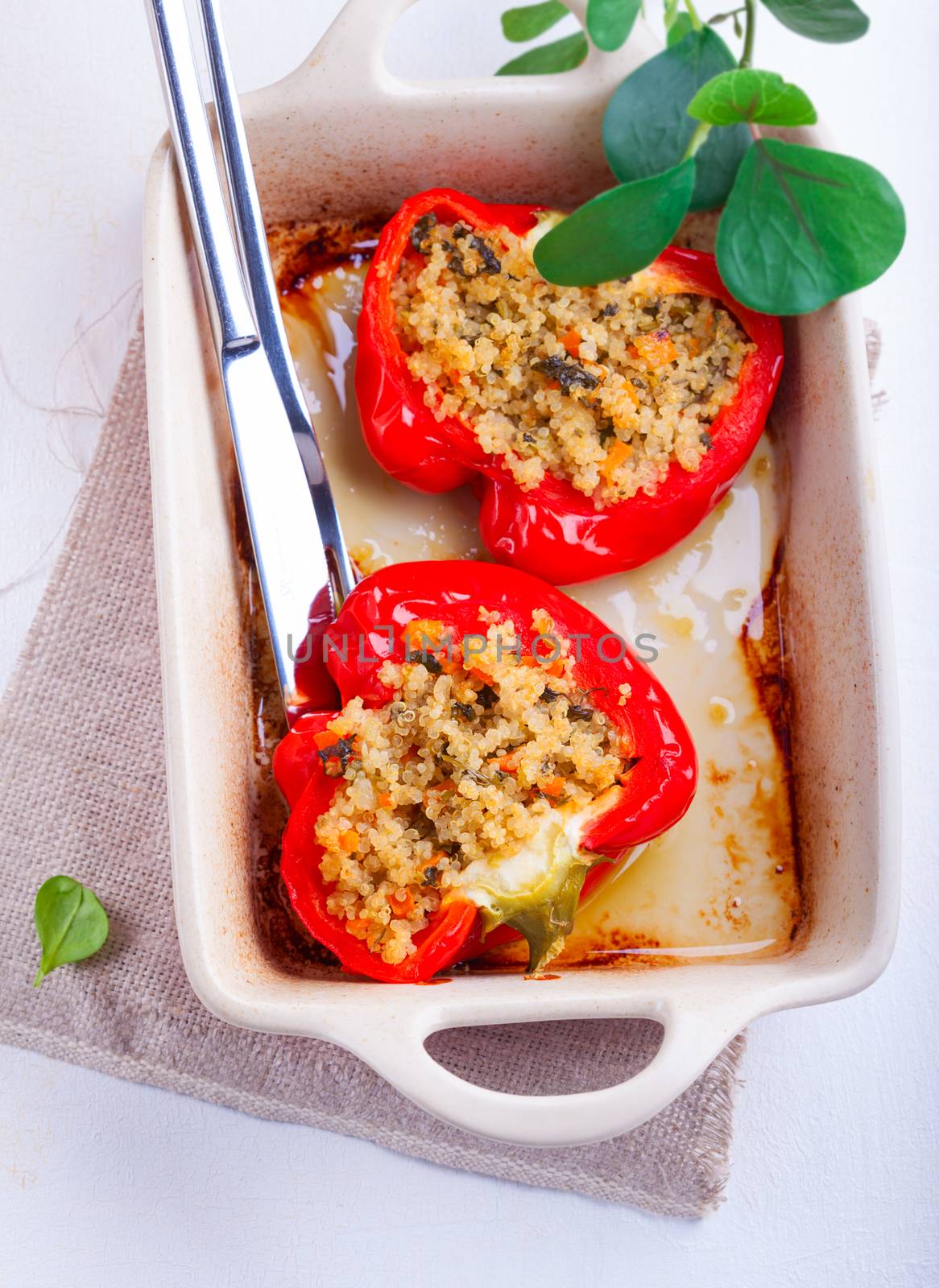 Stuffed red peppers filled with quinoa and vegetables