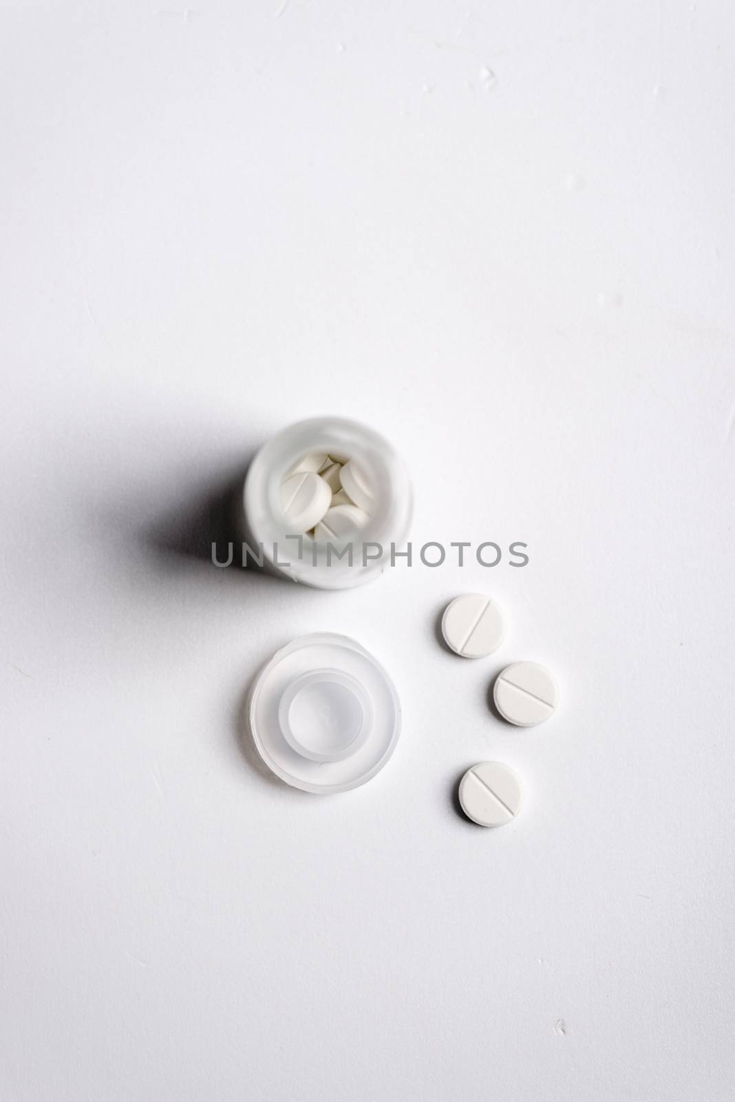 Pills and medicine over a white board
