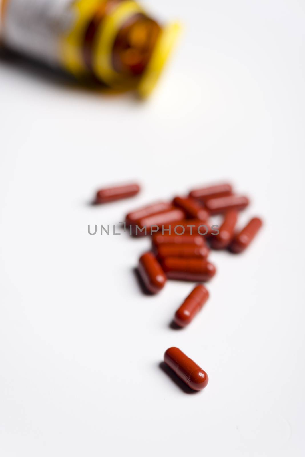 Pills and medicine over a white board