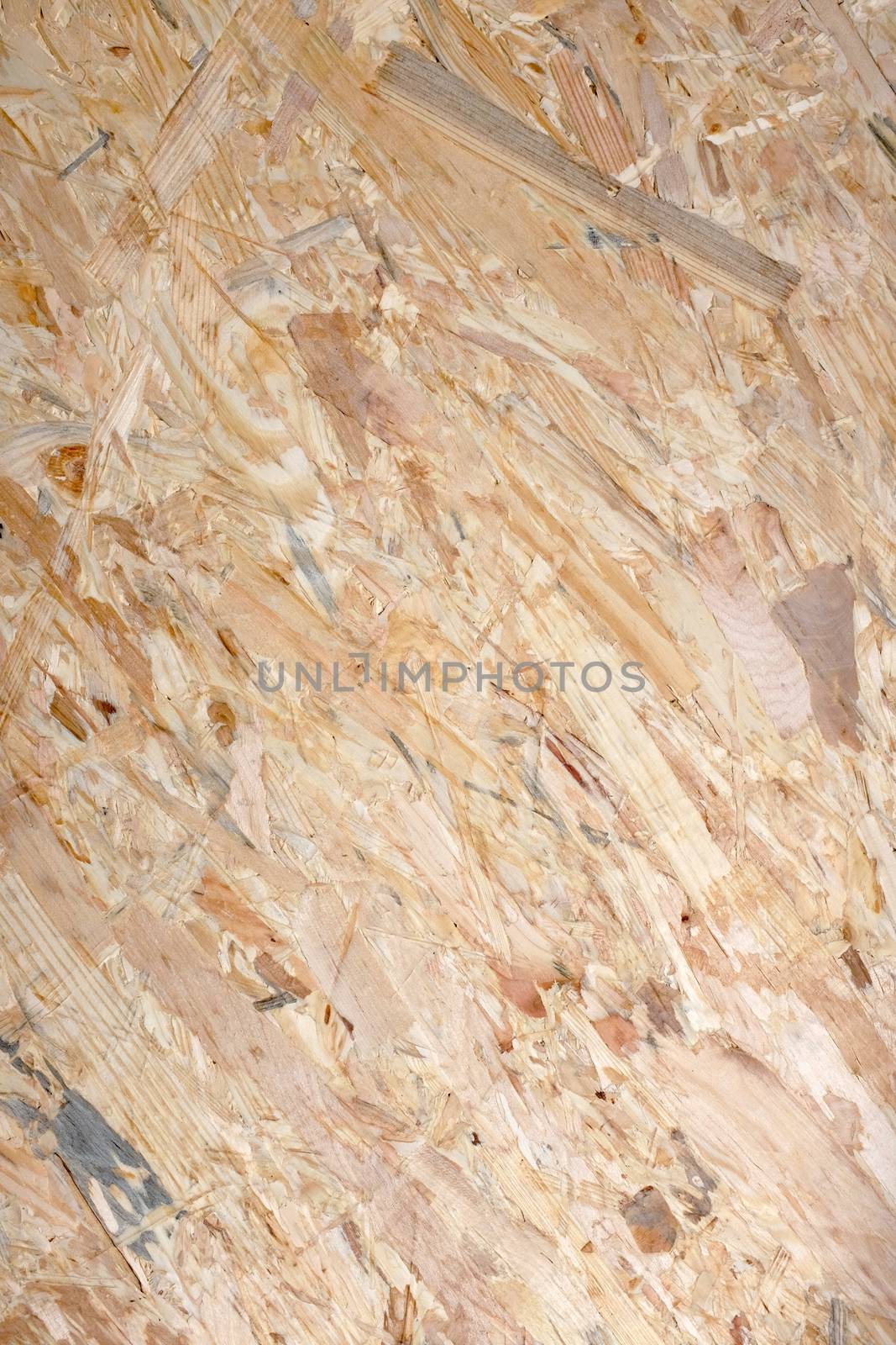 Oriented strand board background. Common building material formed from coarse strips of wood and adhesive.