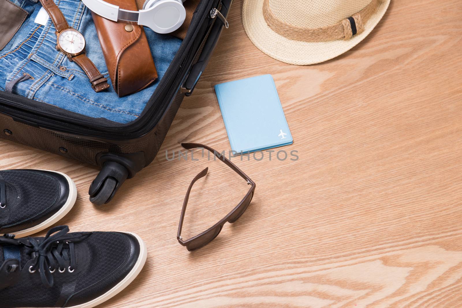 Travel and vacations concept. Open traveler's bag with clothing, by makidotvn