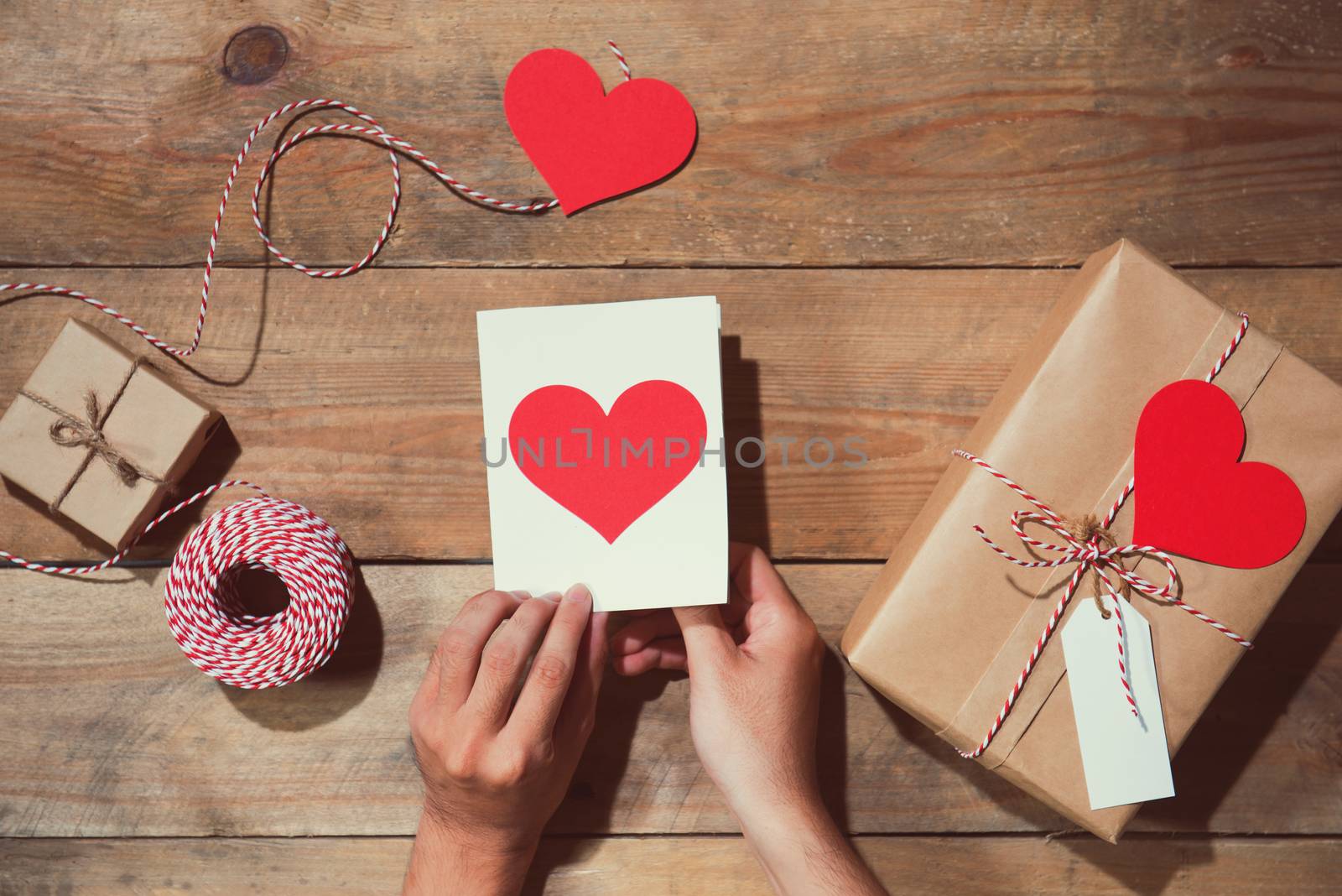 Valentine's decorated gift box over wooden background. View from by makidotvn