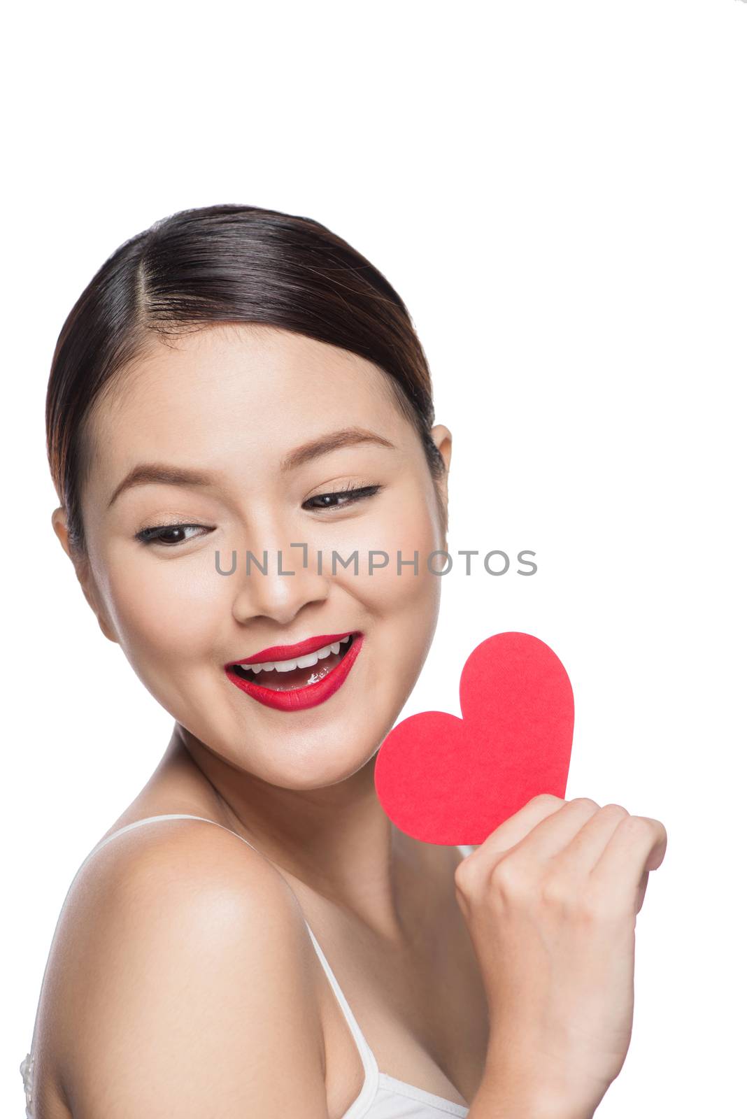 Cute attractive young woman with red heart. Valentine's day art portrait. Perfect make up