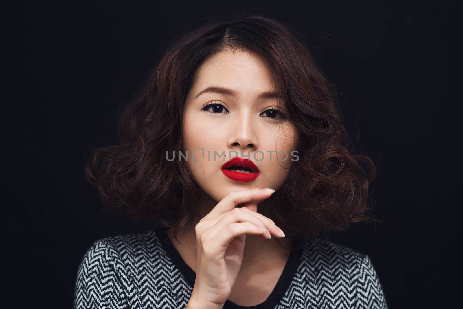 Beauty portrait of asian woman. Magnificent model posing on blac by makidotvn