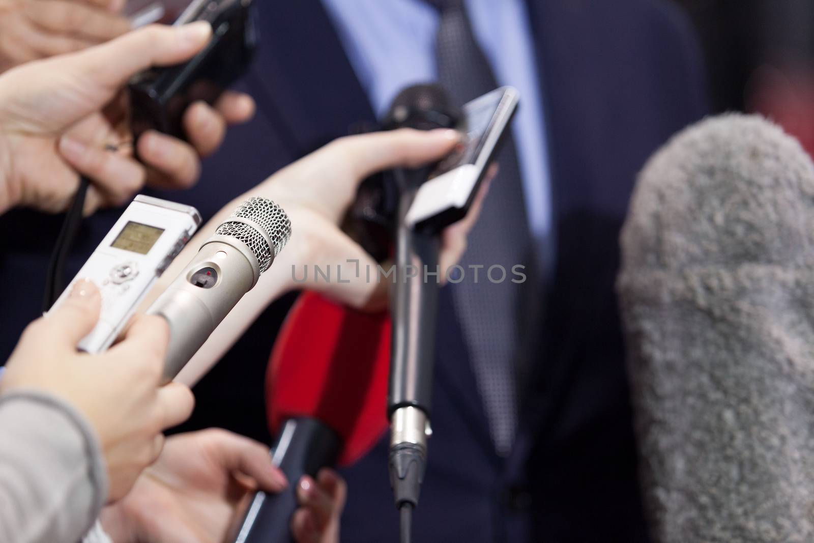 Journalists making media interview with businessman or politician. Press conference.