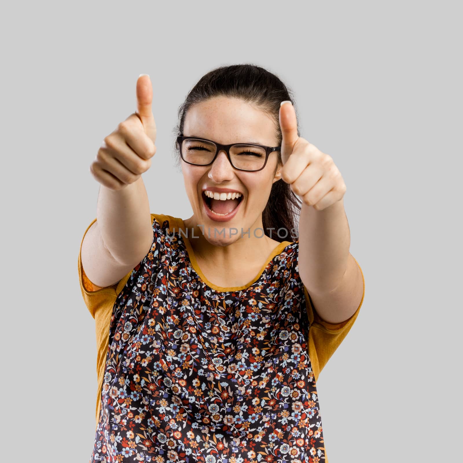 Portrait of beautilful woman making with thumbs up