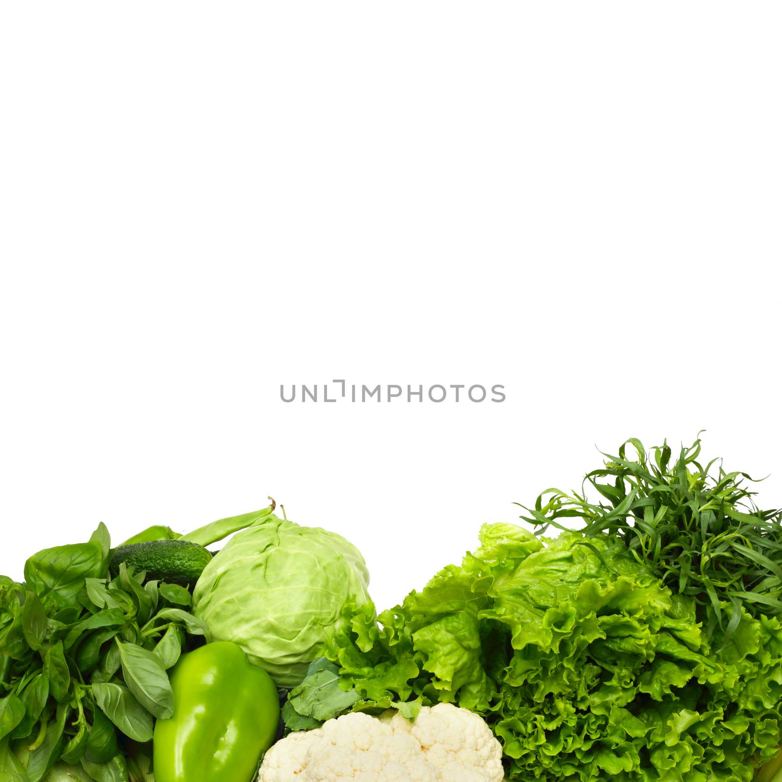 Pile of green vegetables isolated on white background with copy space
