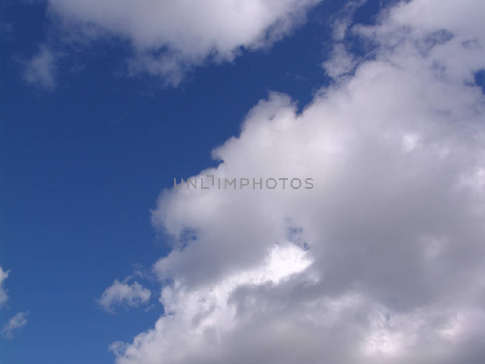 Blue sky with clouds and sun by elena_vz
