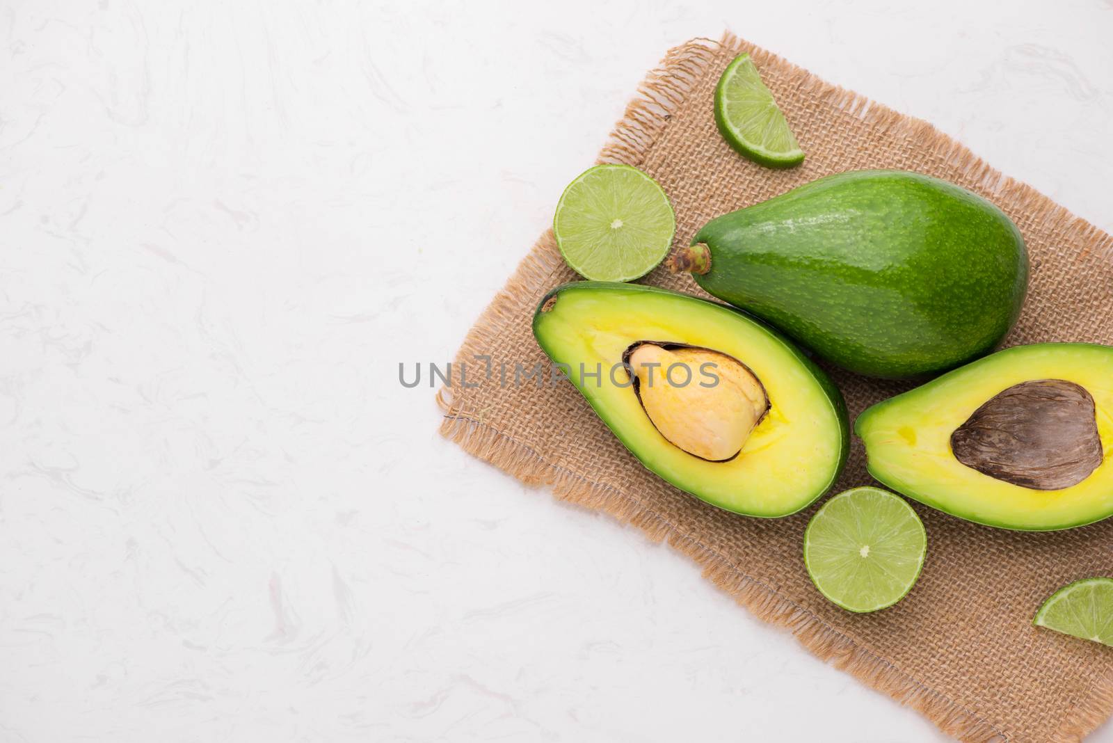 Healthy food concept. Fresh organic avocado on table