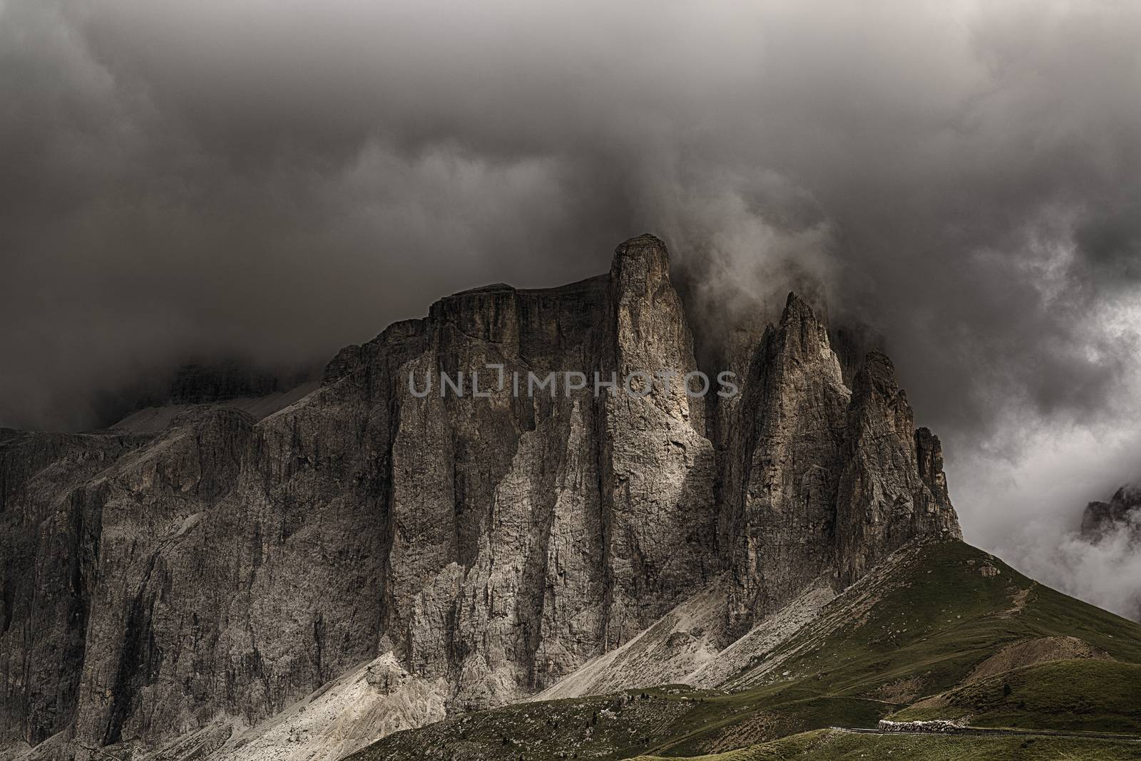 Storm formation over the top of Sella Tower in summer season, danger for mountain climbing