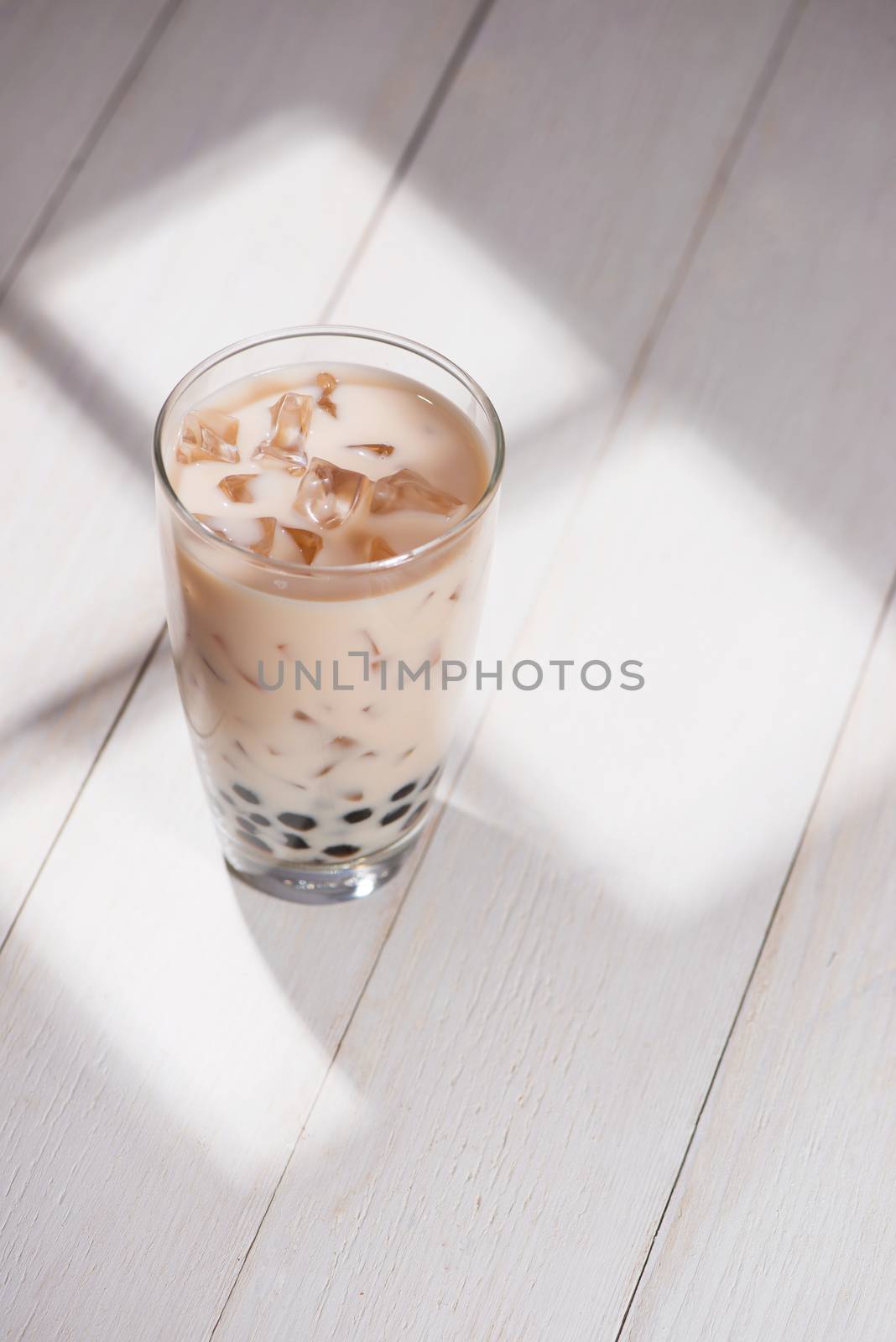 Boba / Bubble tea. Homemade Taro Milk Tea with Pearls on wooden  by makidotvn