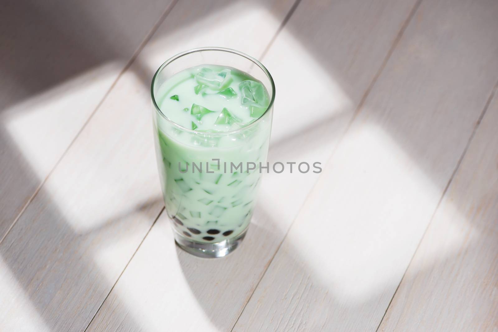 Boba / Bubble tea. Homemade Milk Tea with Pearls on wooden table.