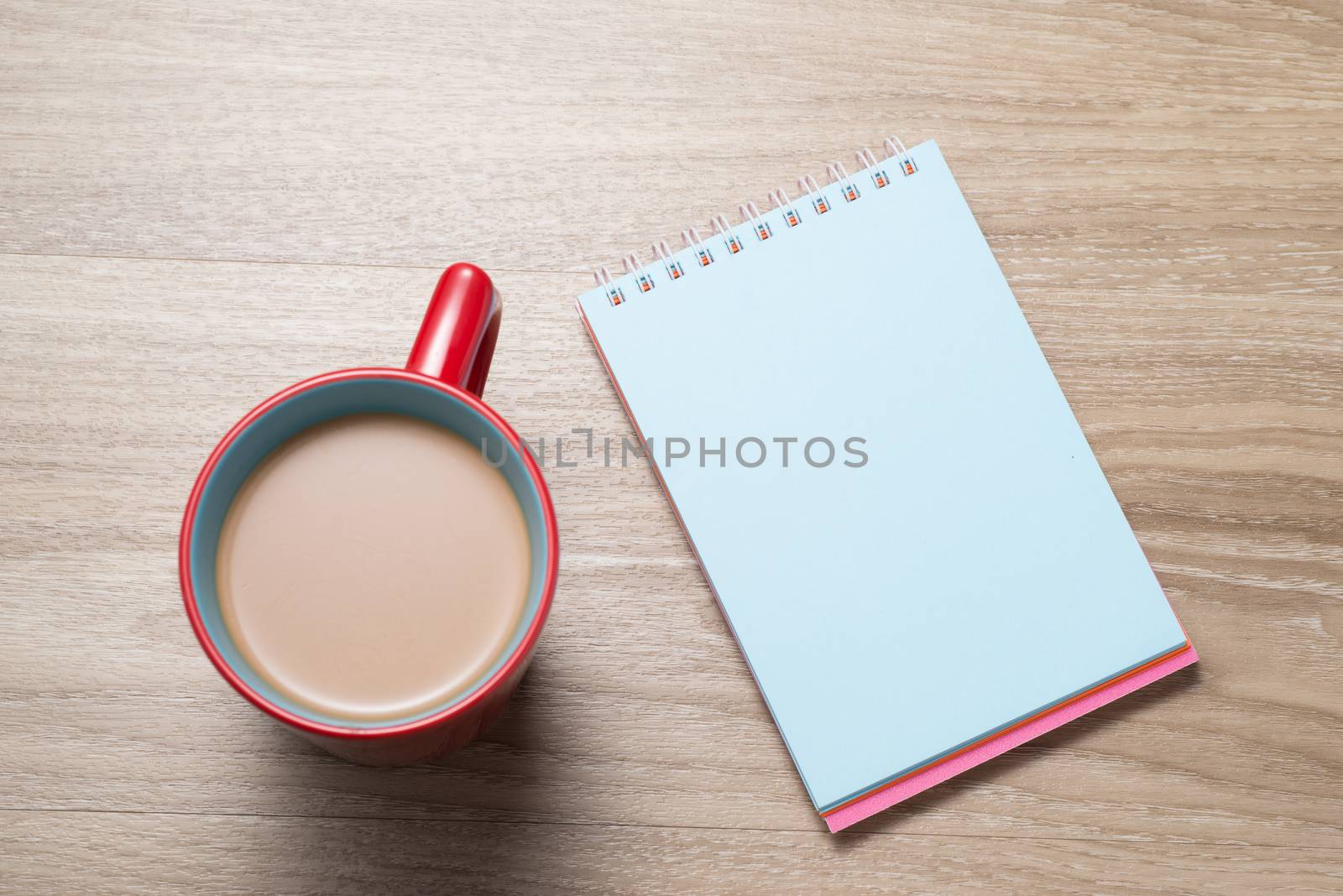 Blank paper and cup of coffee on the desk