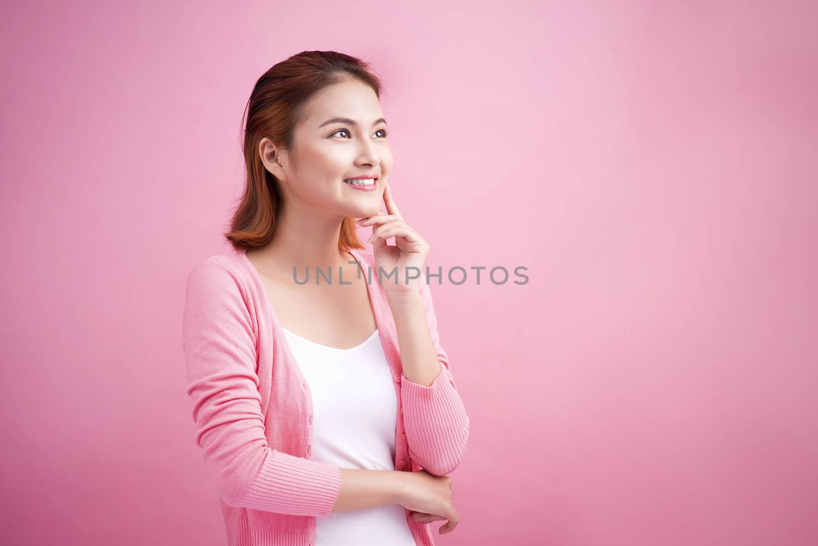 Beauty Asian Young Portrait. Beautiful Thinking Woman Touching her Face. 