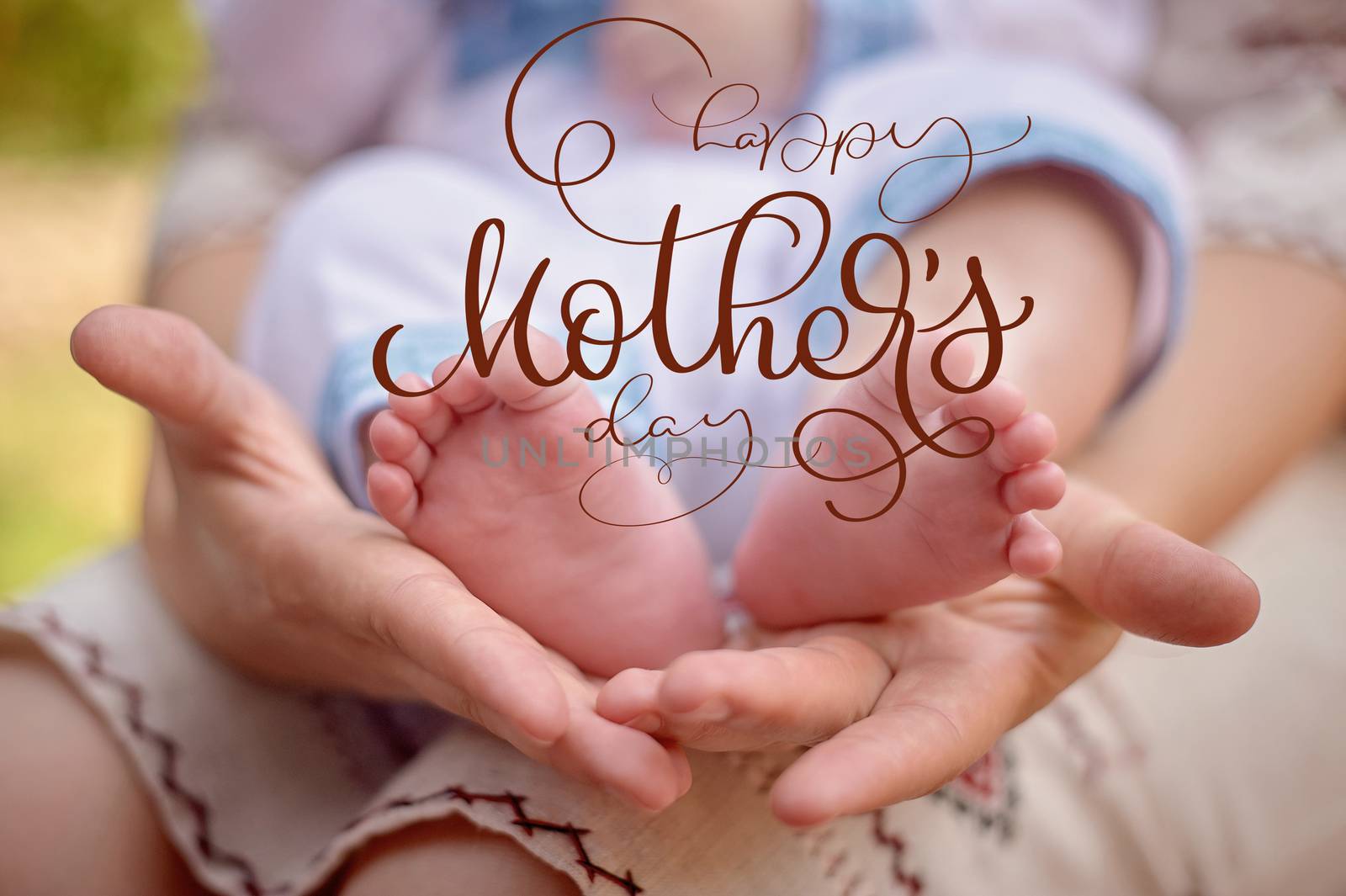 Mother hold the feet of her newborn son and Happy mothers day text. Calligraphy lettering hand draw by timonko