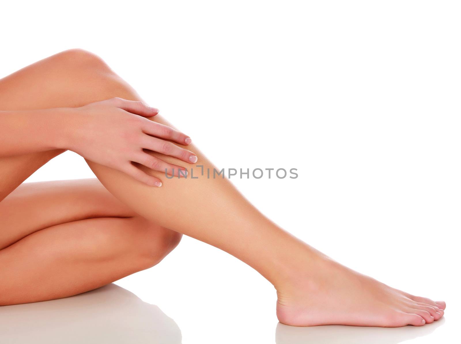 Woman's legs on white background, isolated by Nobilior
