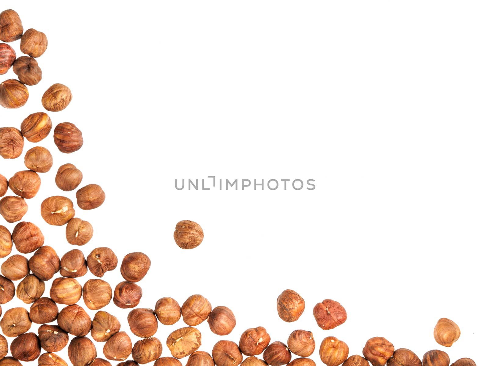Background of hazelnuts with copy space. Isolated one edge. Top view or flat lay