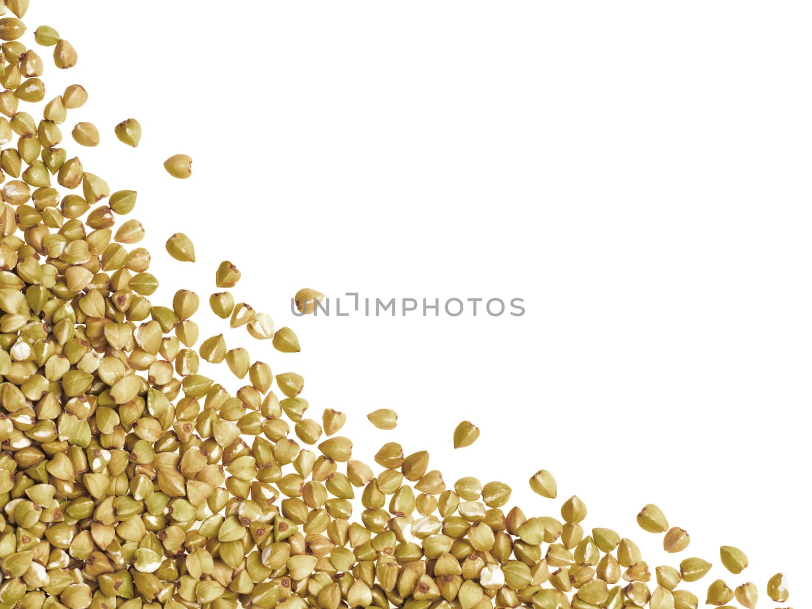 Raw green buckwheat with copy space. Isolated one edge. Top view or flat lay.