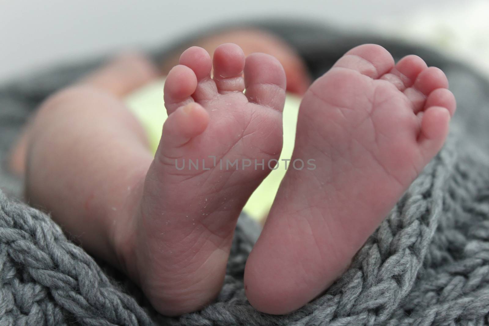 Sleeping baby with tiny feet.