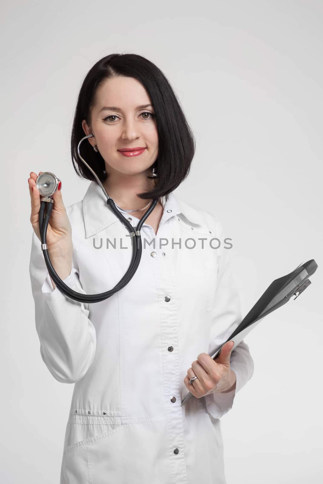 the beautiful woman the doctor with a stethoscope by sveter