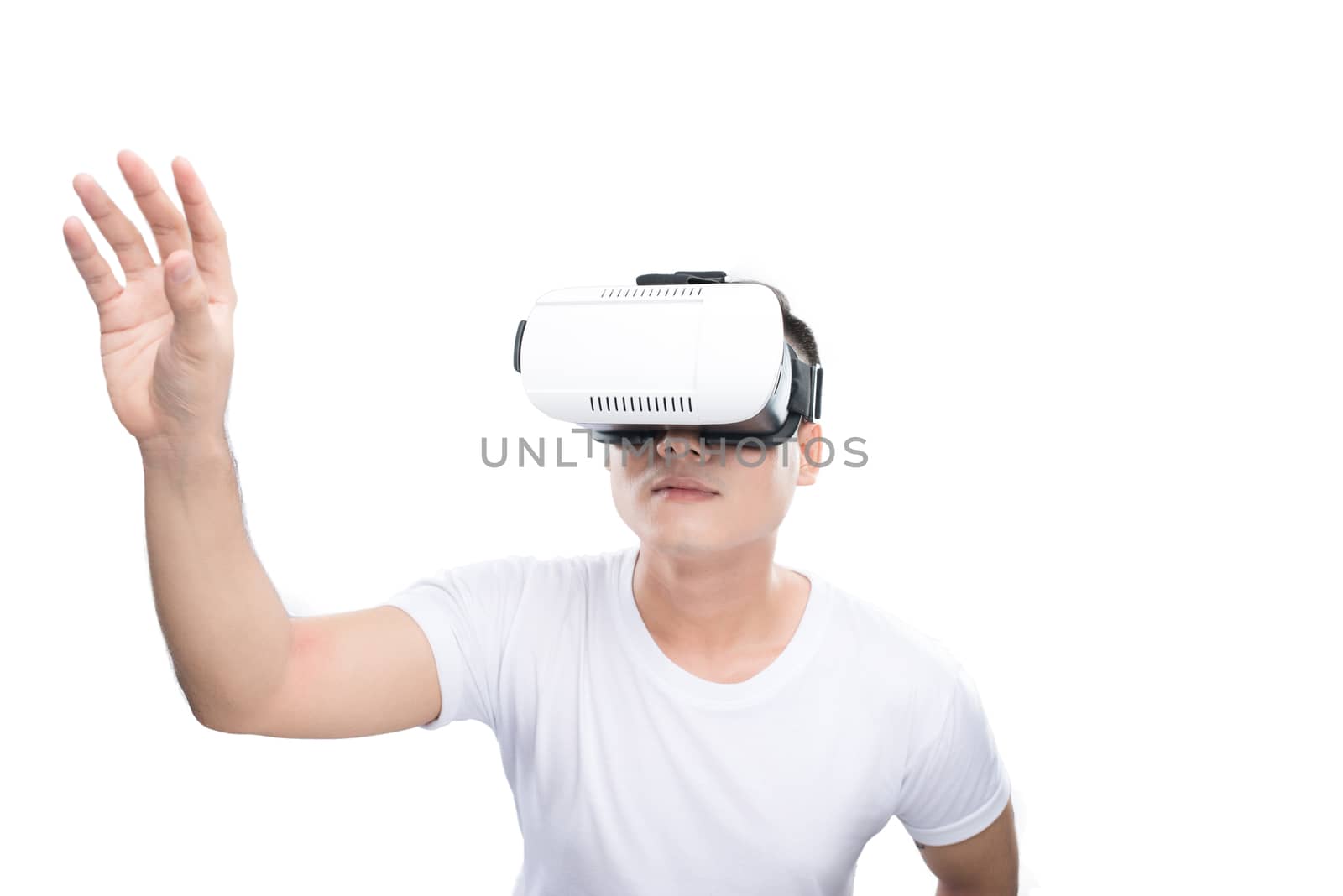 Happy young asian man using the virtual reality headset isolated on white with copy space