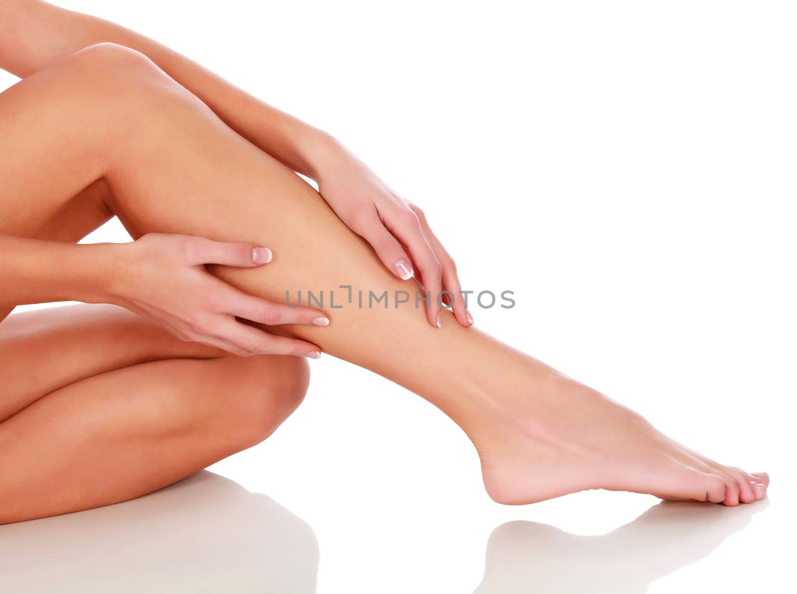 Woman's legs on white background, isolated