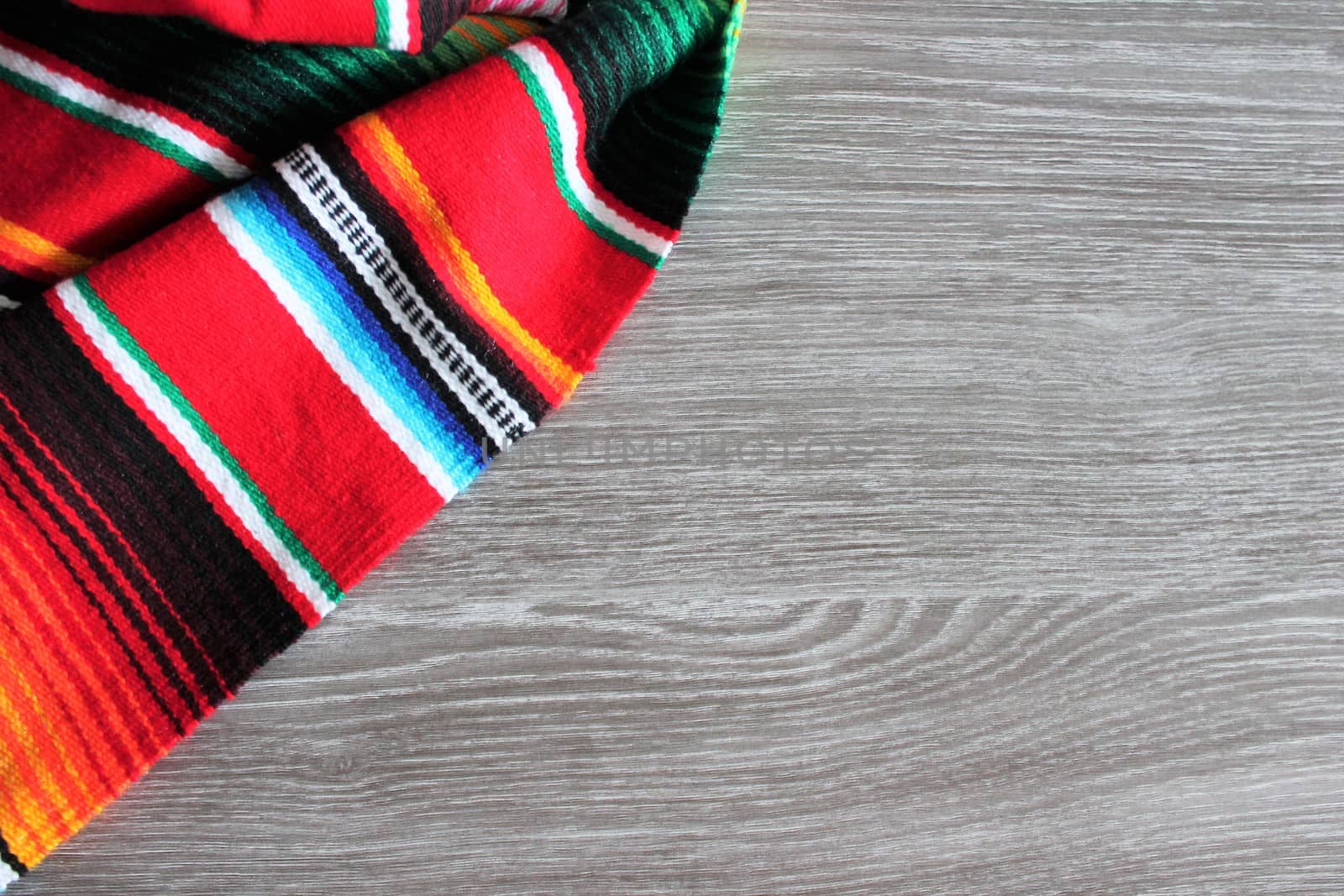 poncho serape background Mexican cinco de mayo fiesta wooden copy space