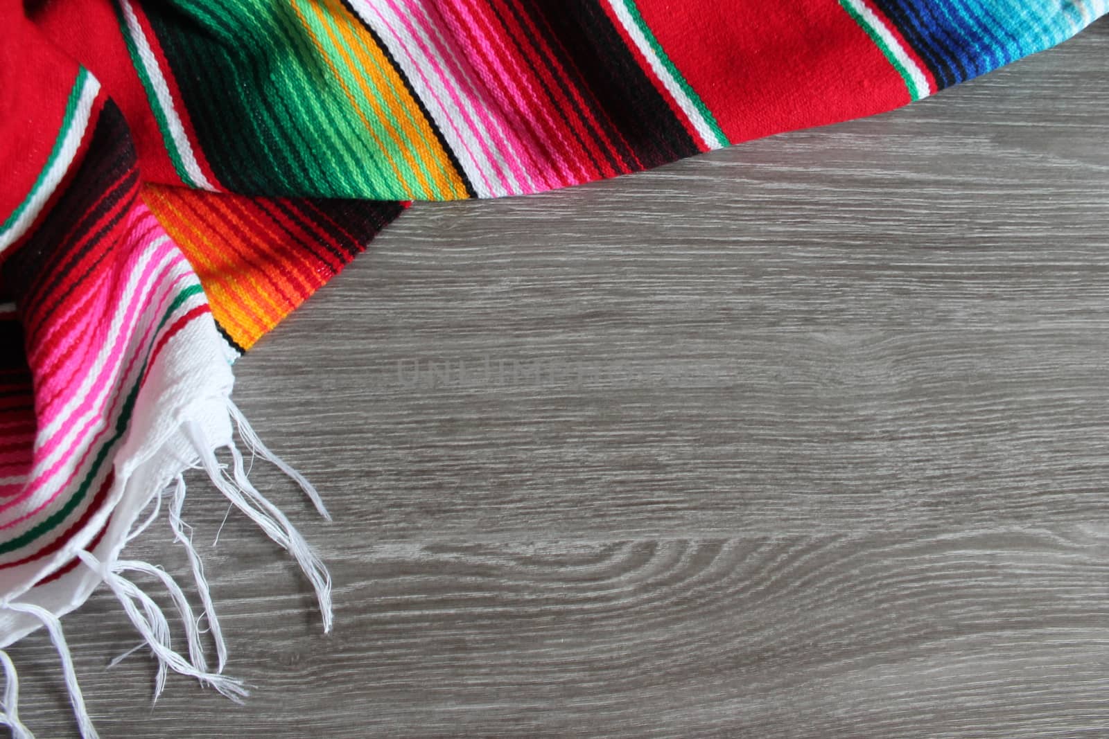 poncho serape background Mexican cinco de mayo fiesta wooden copy space