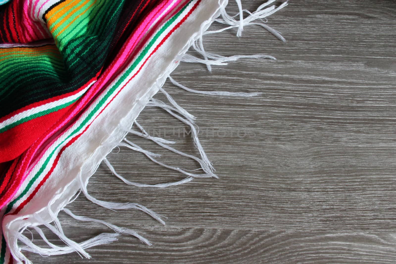 poncho serape background Mexican cinco de mayo fiesta wooden copy space by cheekylorns