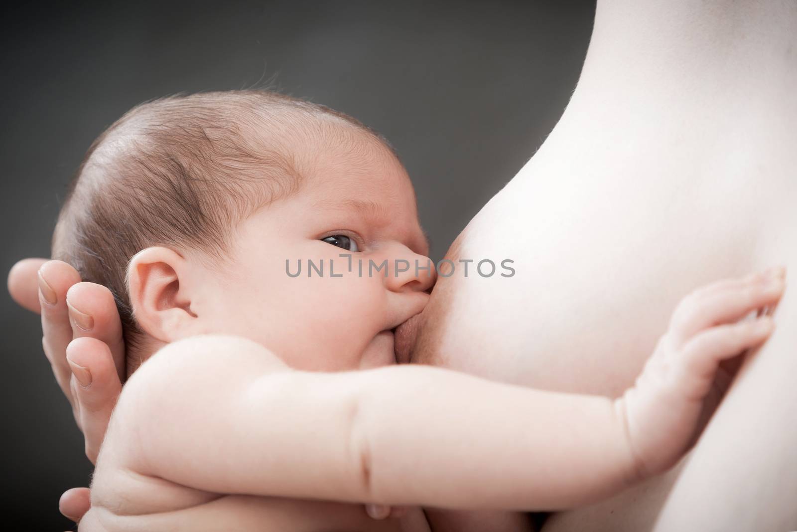 Baby feeds on mother's breasts milk by sveter