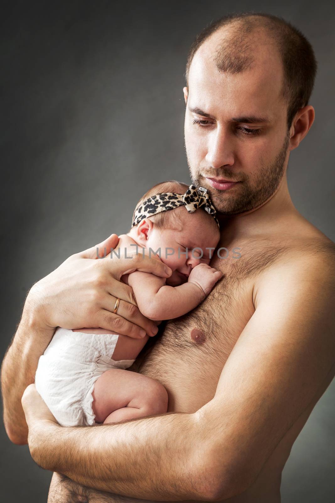 newborn child and father by sveter