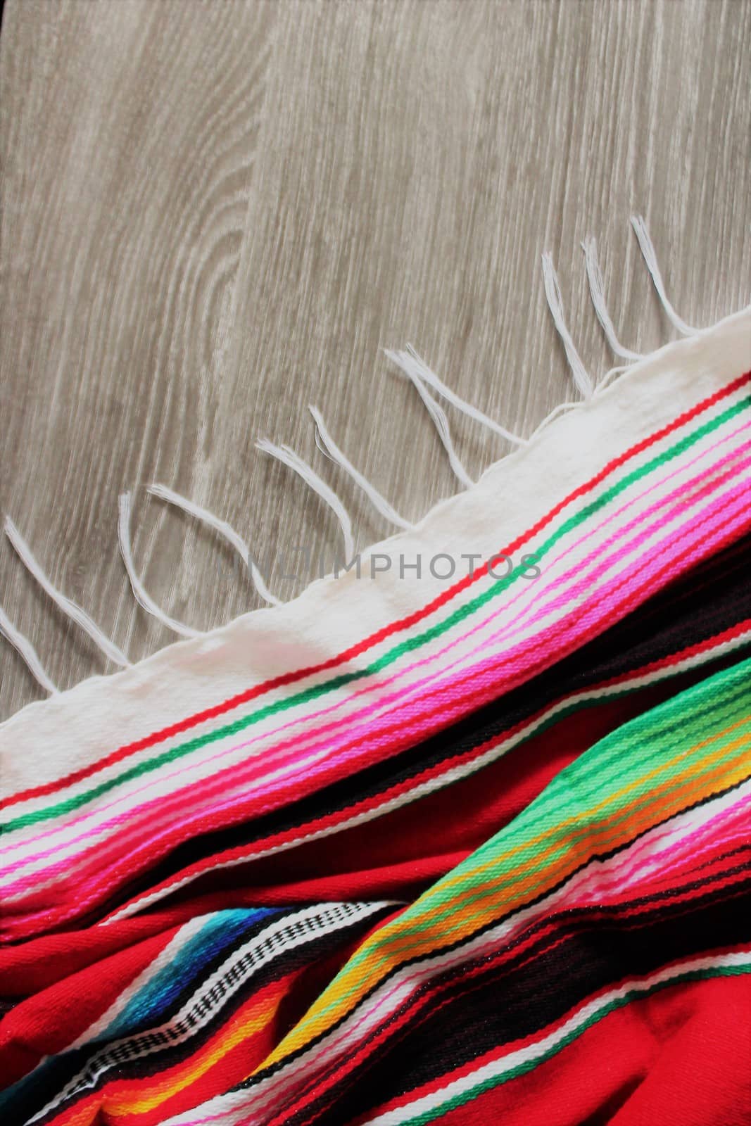 poncho serape background Mexican cinco de mayo fiesta wooden copy space by cheekylorns