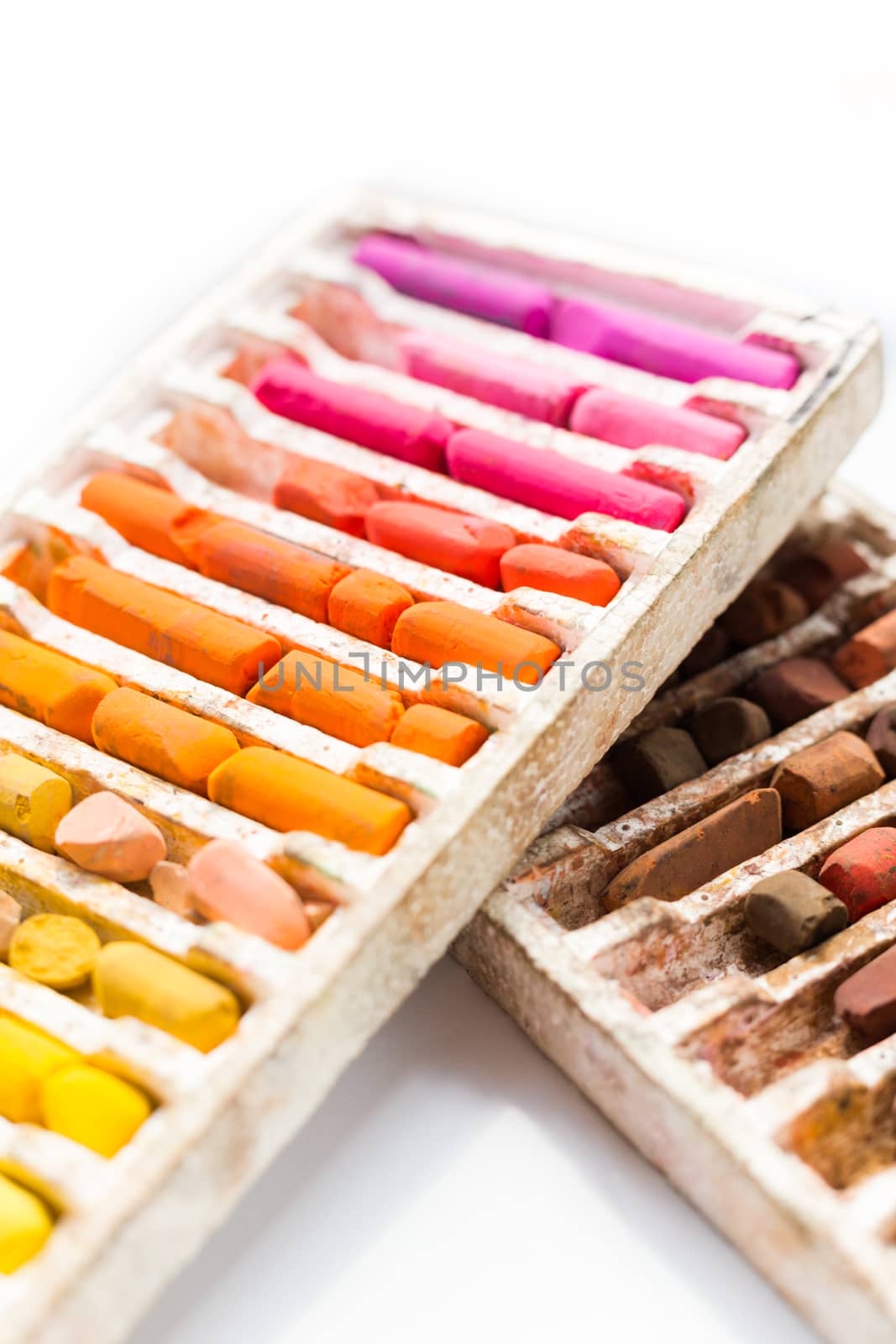 Pastel crayons colorful set in box isolated on white background