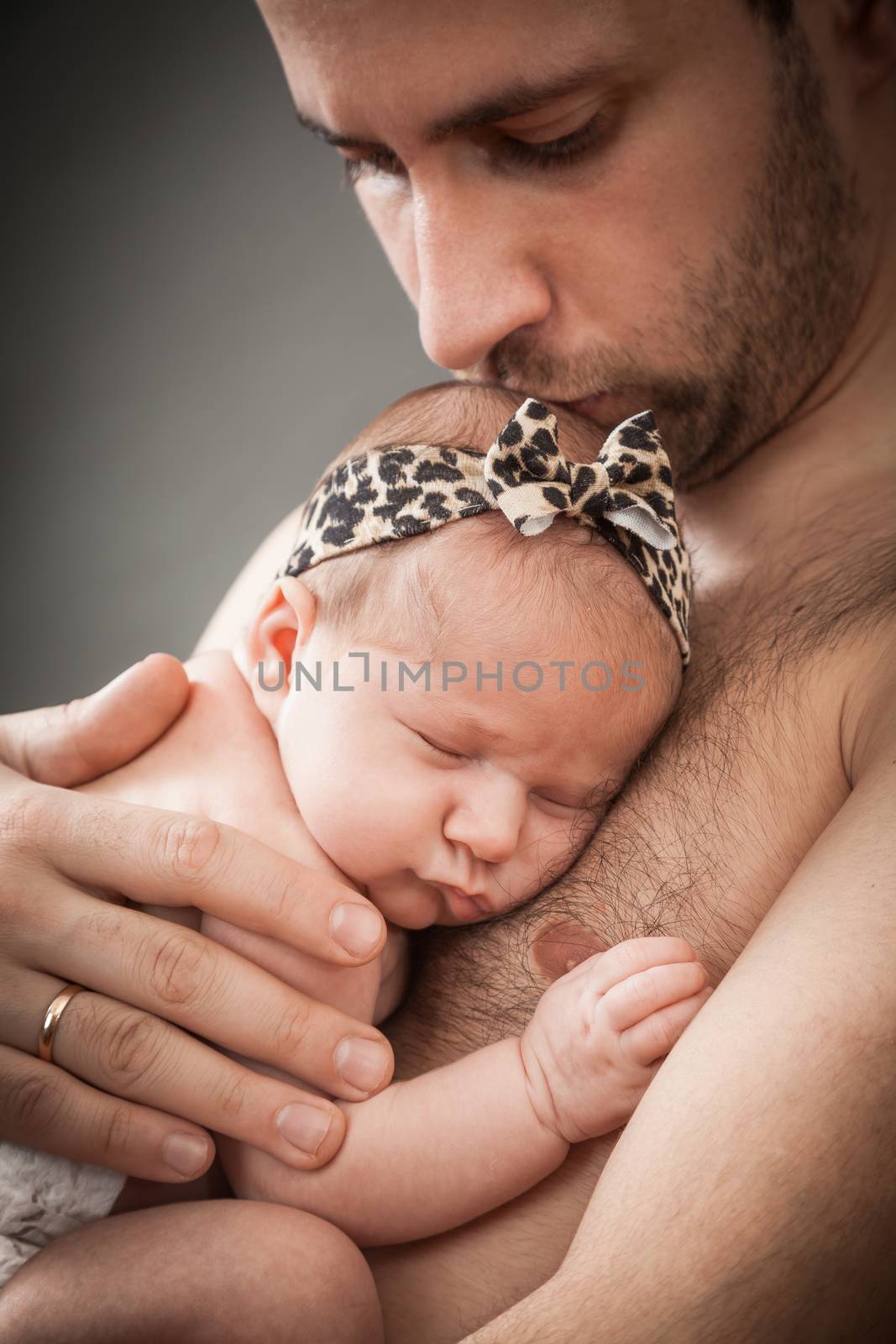 newborn child and father by sveter