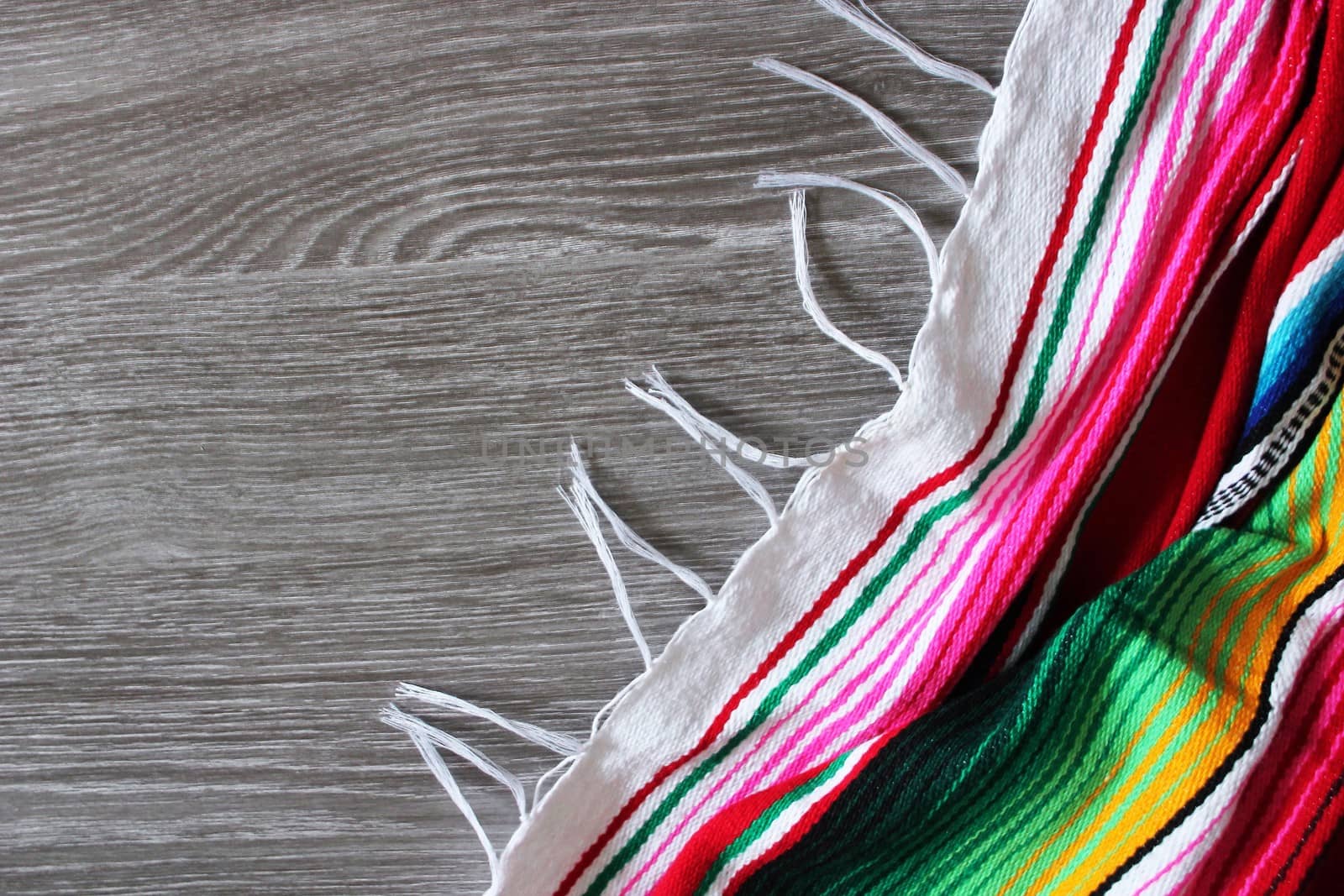 poncho serape background Mexican cinco de mayo fiesta wooden copy space by cheekylorns