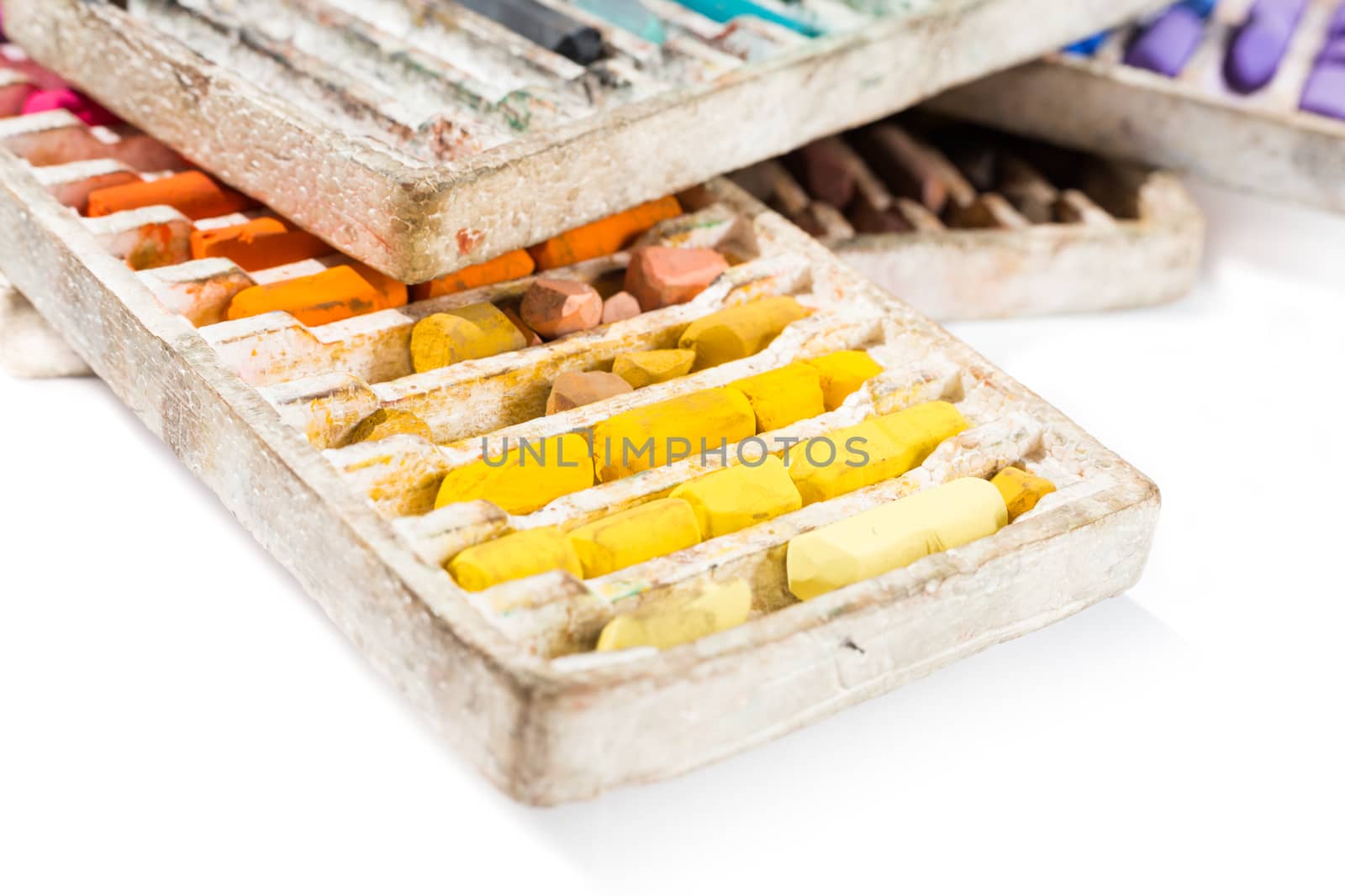 Pastel crayons colorful set in box isolated on white background