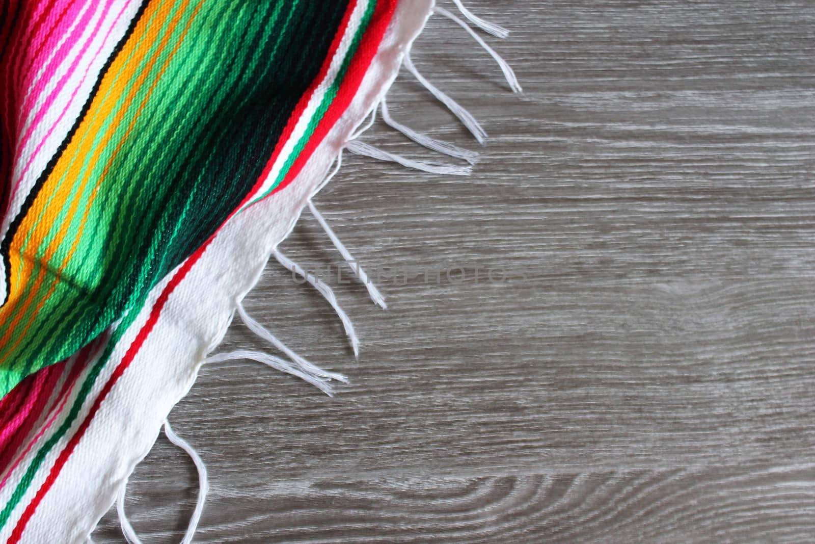 poncho serape background Mexican cinco de mayo fiesta wooden copy space