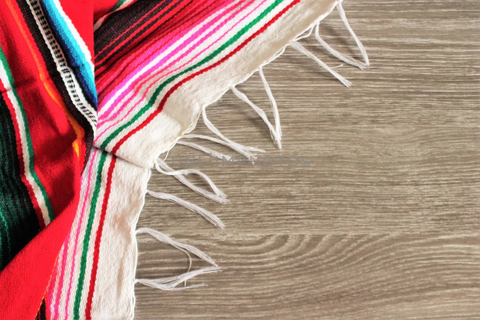 poncho serape background Mexican cinco de mayo fiesta wooden copy space by cheekylorns