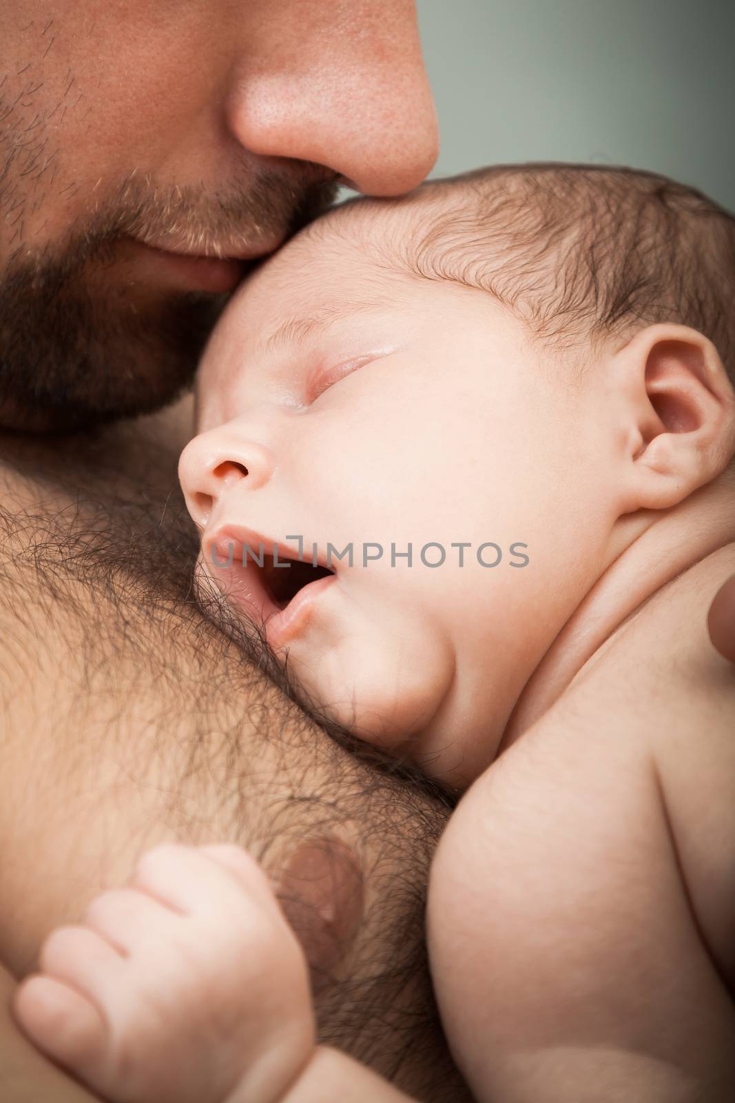 newborn child and father by sveter