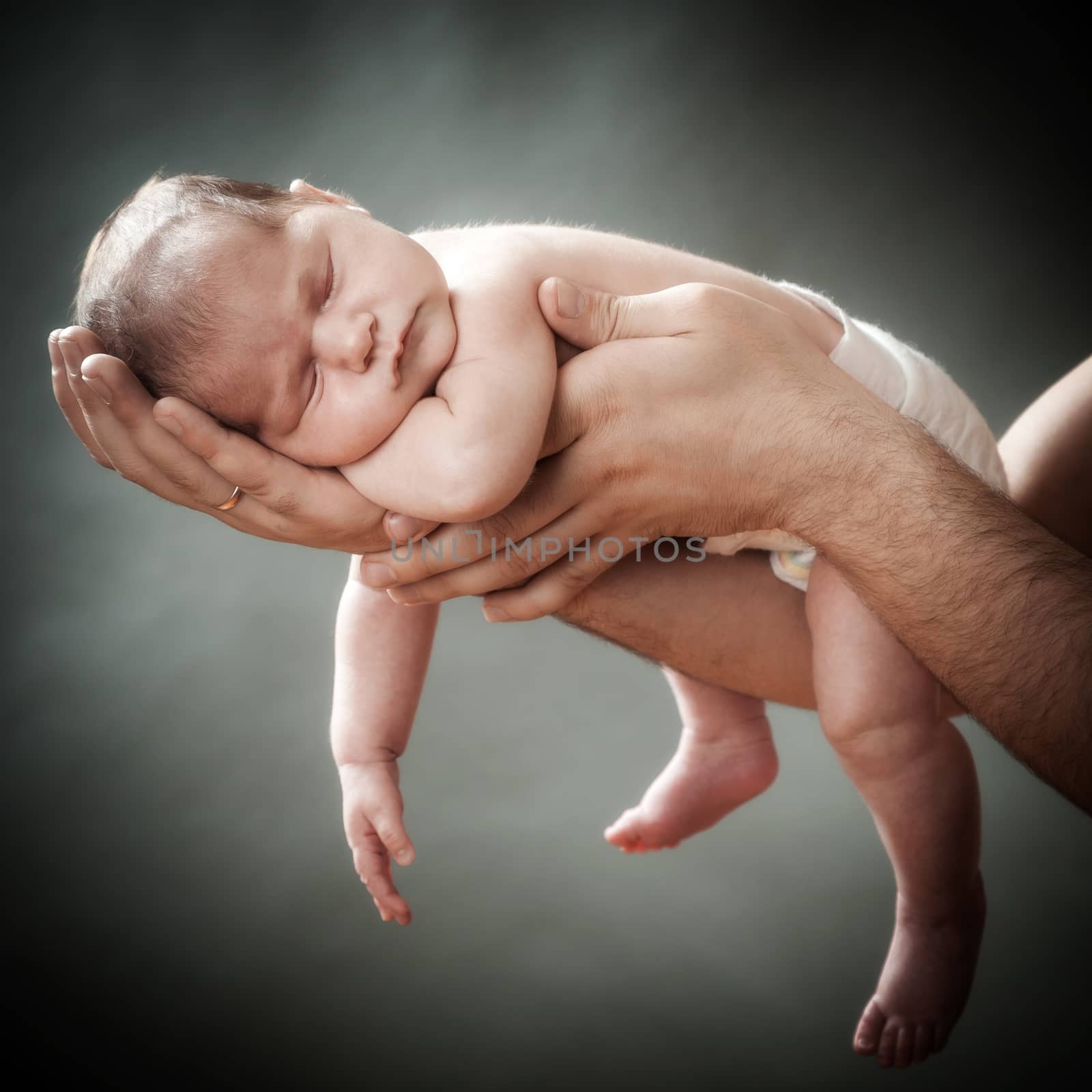 the newborn child on hands by sveter