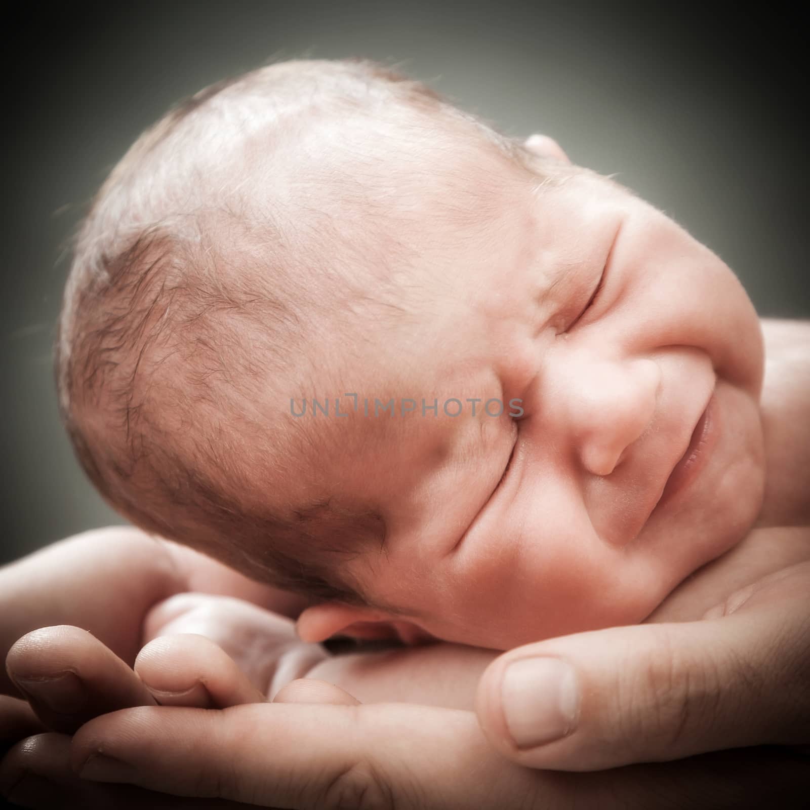 the newborn child on hands by sveter