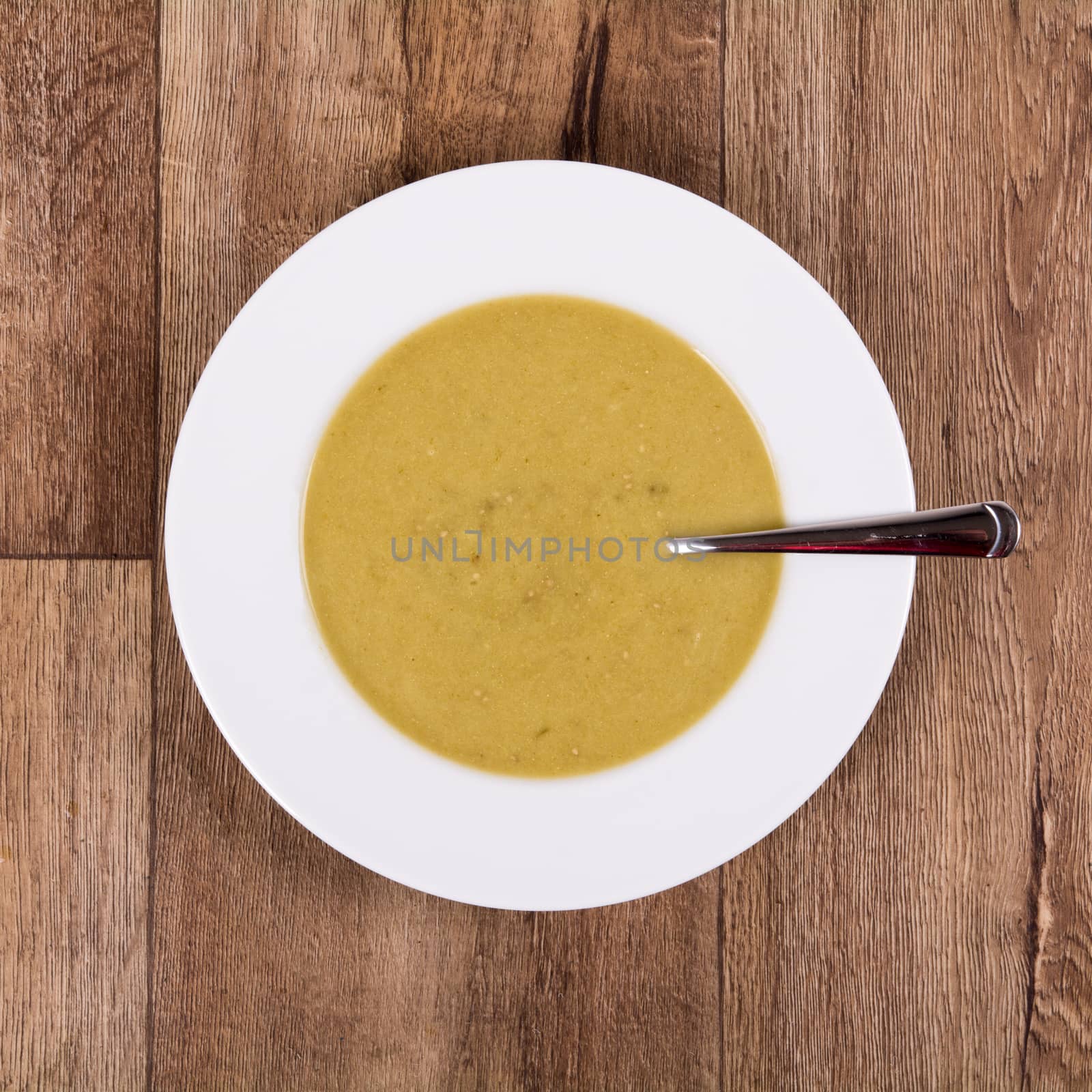 Vegetarian vegetable soup on a wooden table