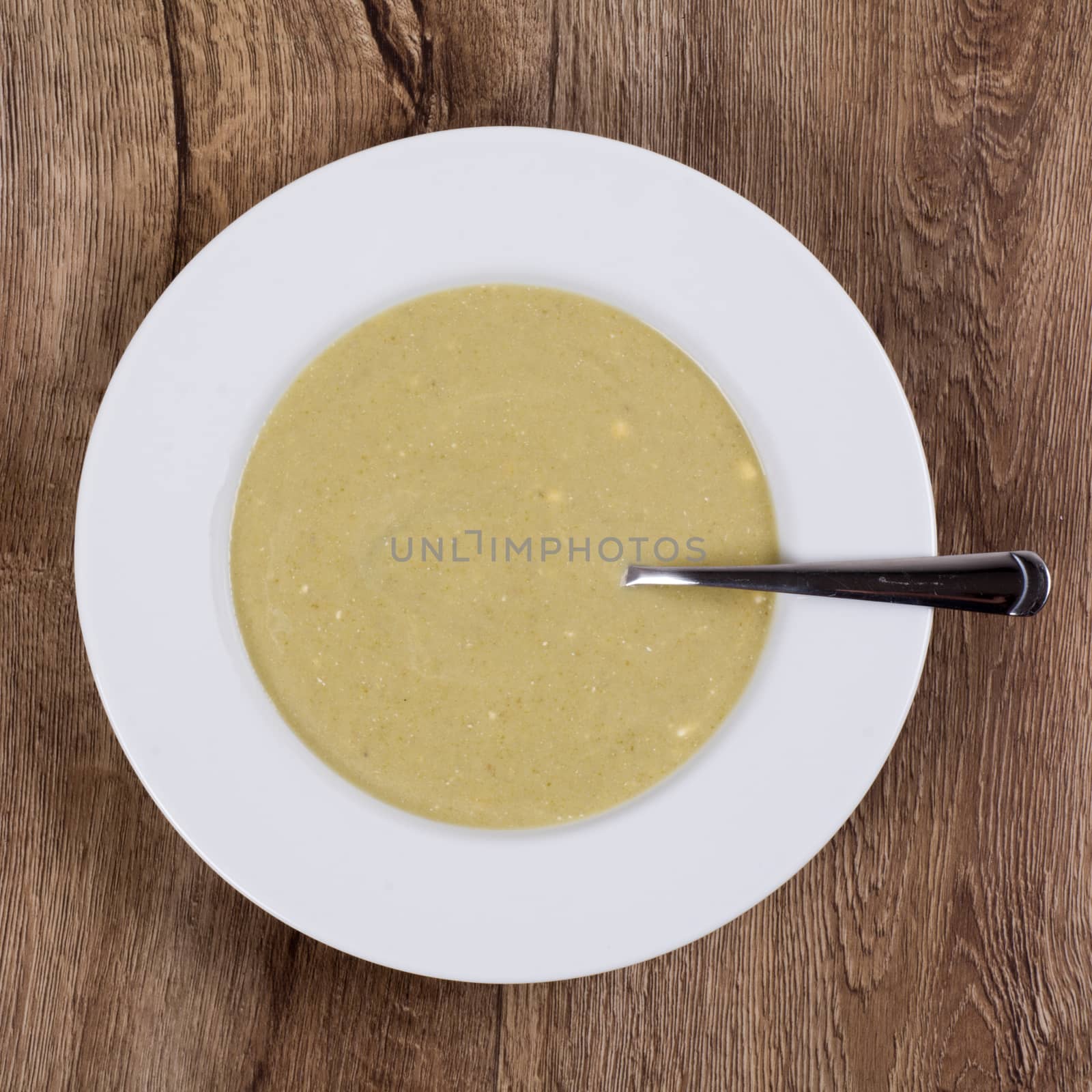 Vegetarian vegetable soup on a wooden table