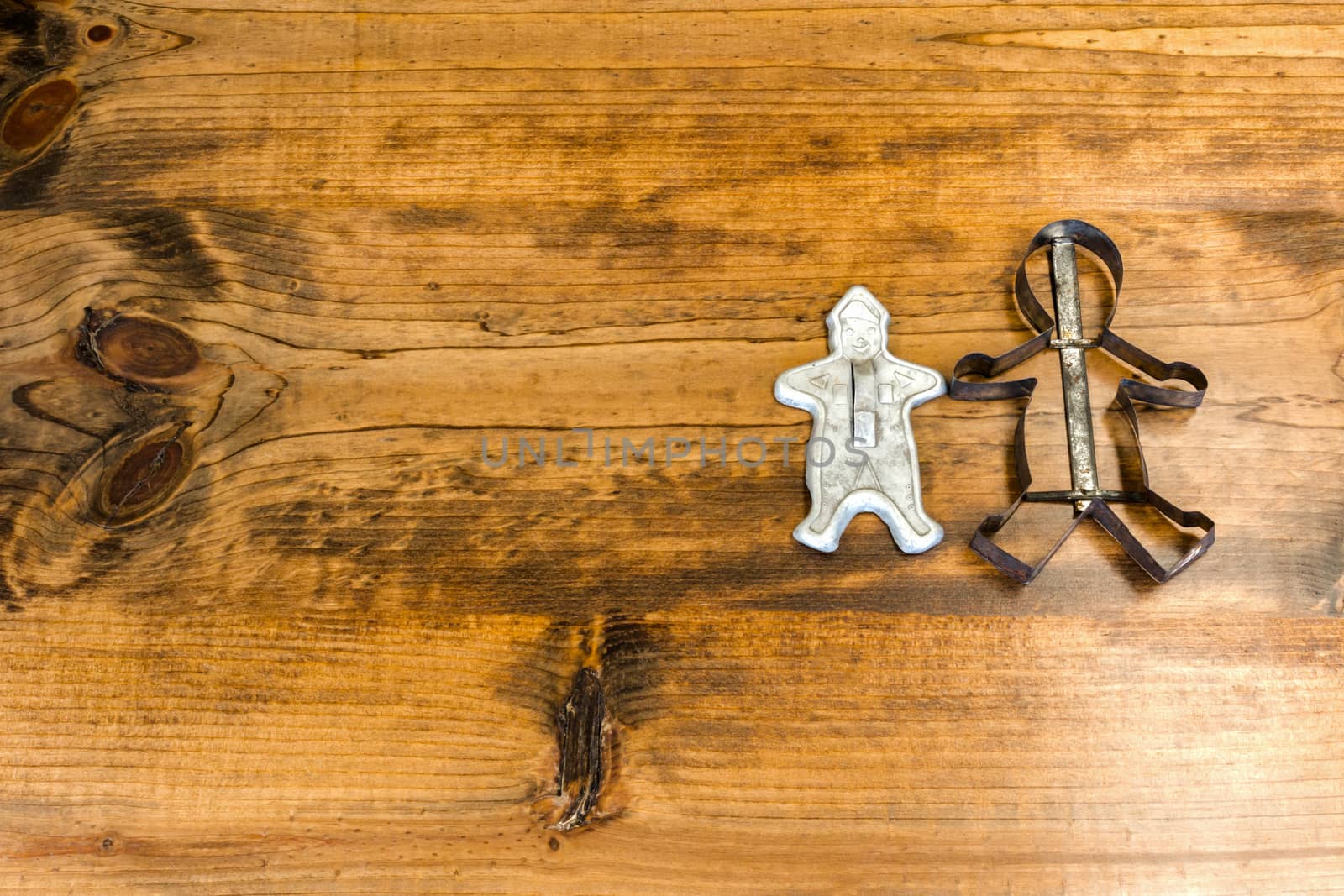 Tin Cookie Cutters Sitting on Wooden Table by gregorydean