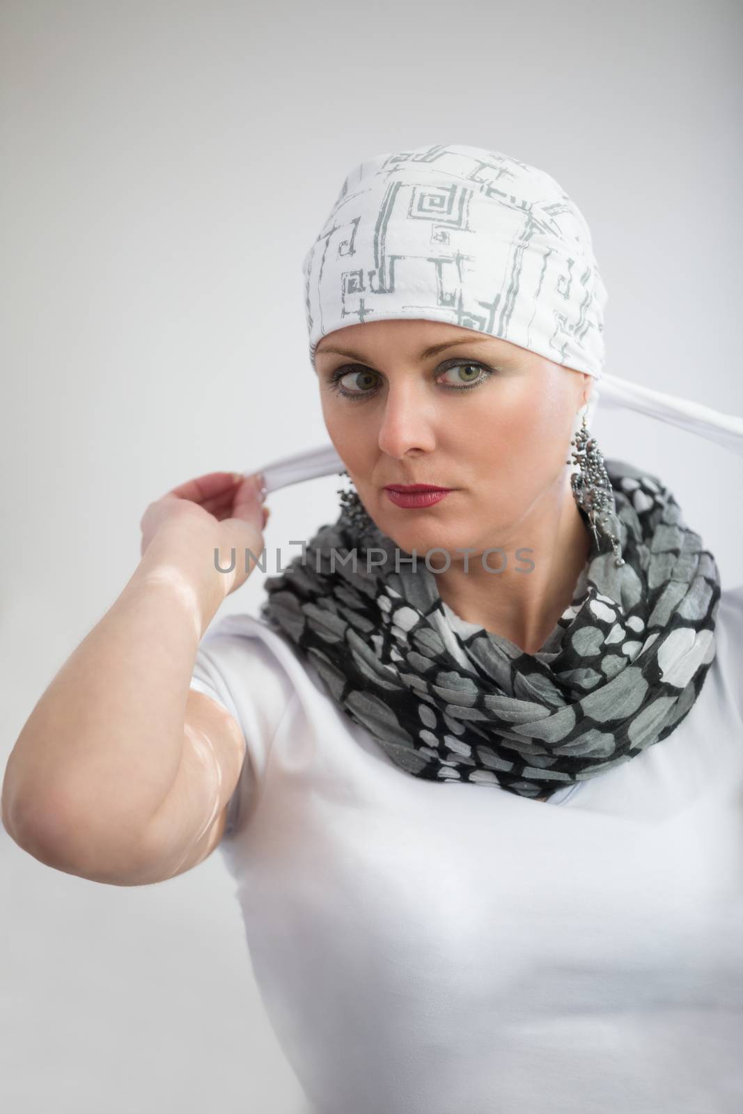 beautiful middle age woman cancer patient wearing headscarf by artush