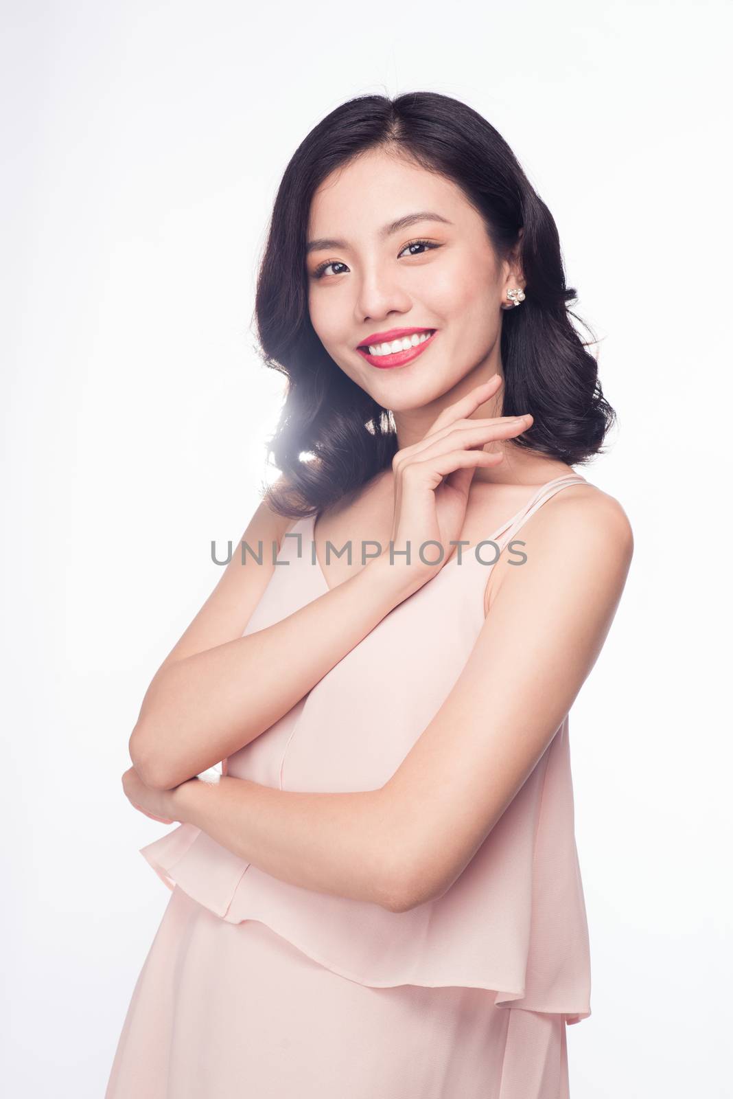 Glamour portrait of beautiful ASIAN woman model with nice makeup and romantic wavy hairstyle.