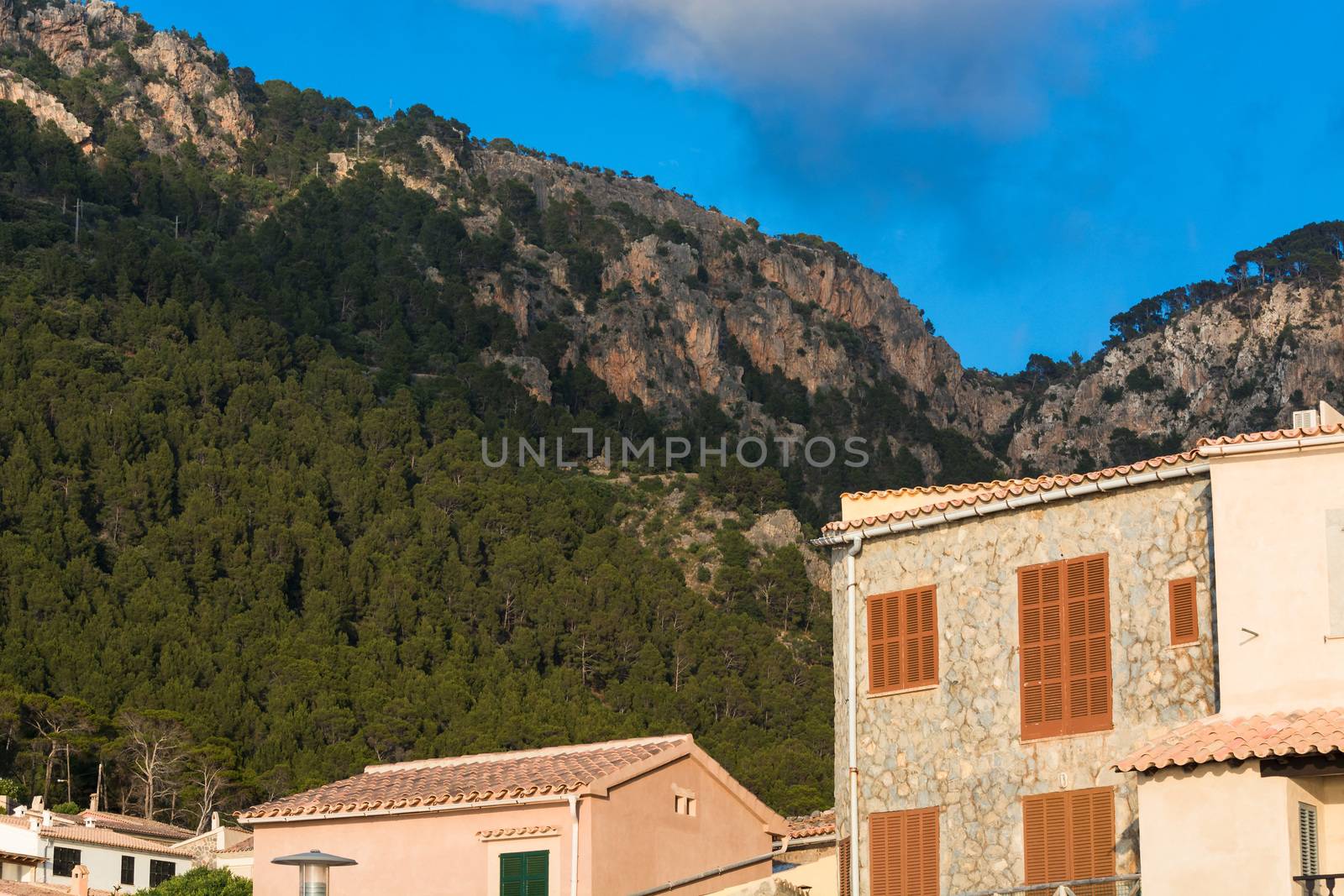 View from the port of Valldemossa to the mountains with the narrow access road.