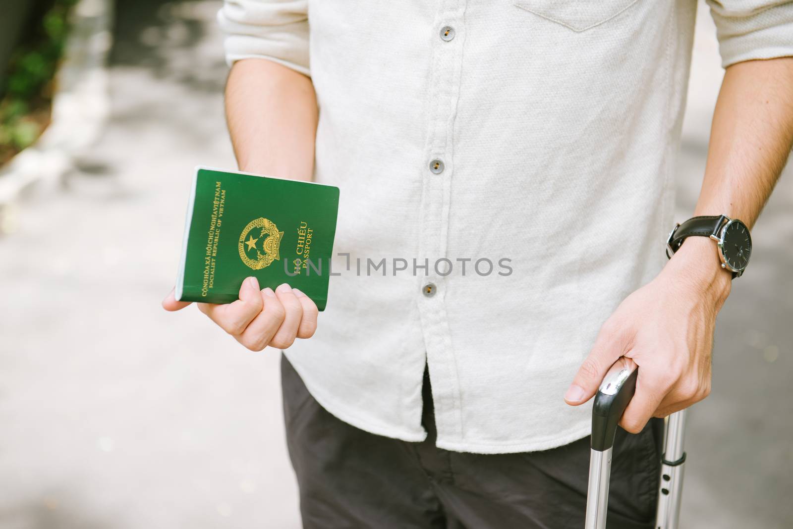 Man hands holding Vietnamese Passport. Ready for traveling.