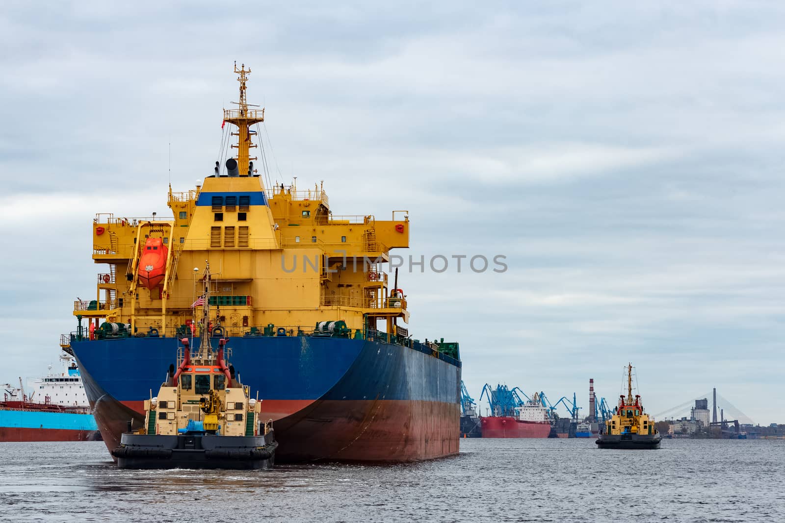 Blue cargo ship entering the port of Riga, Europe